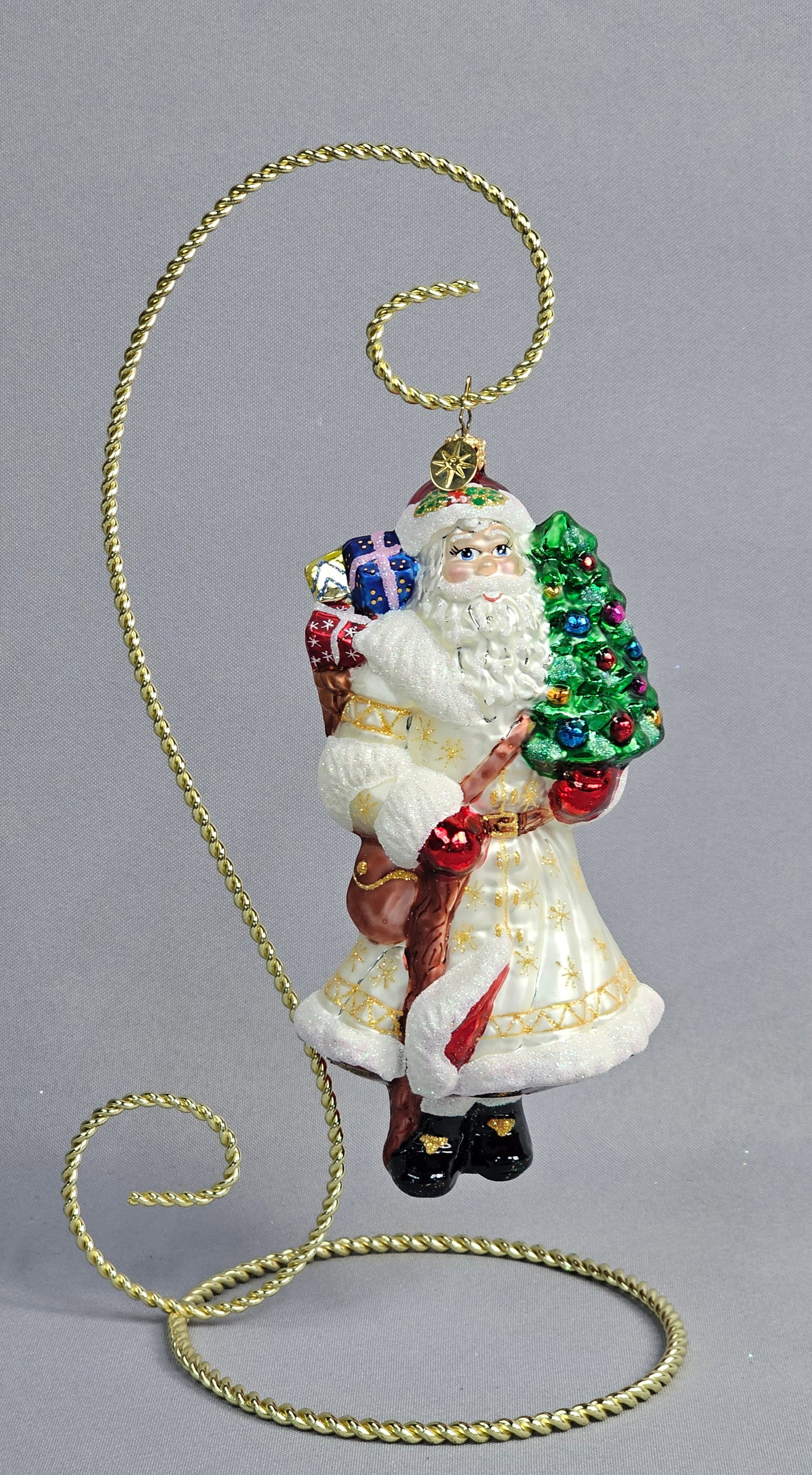 Christopher Radko Victorian Visitor 19th Century English Santa Glass Ornament: A hand-painted, mouth-blown glass Christmas ornament by Christopher Radko. This figurine, titled Victorian Visitor, is part of the Santa Through the Centuries collection and represents a 19th Century 
