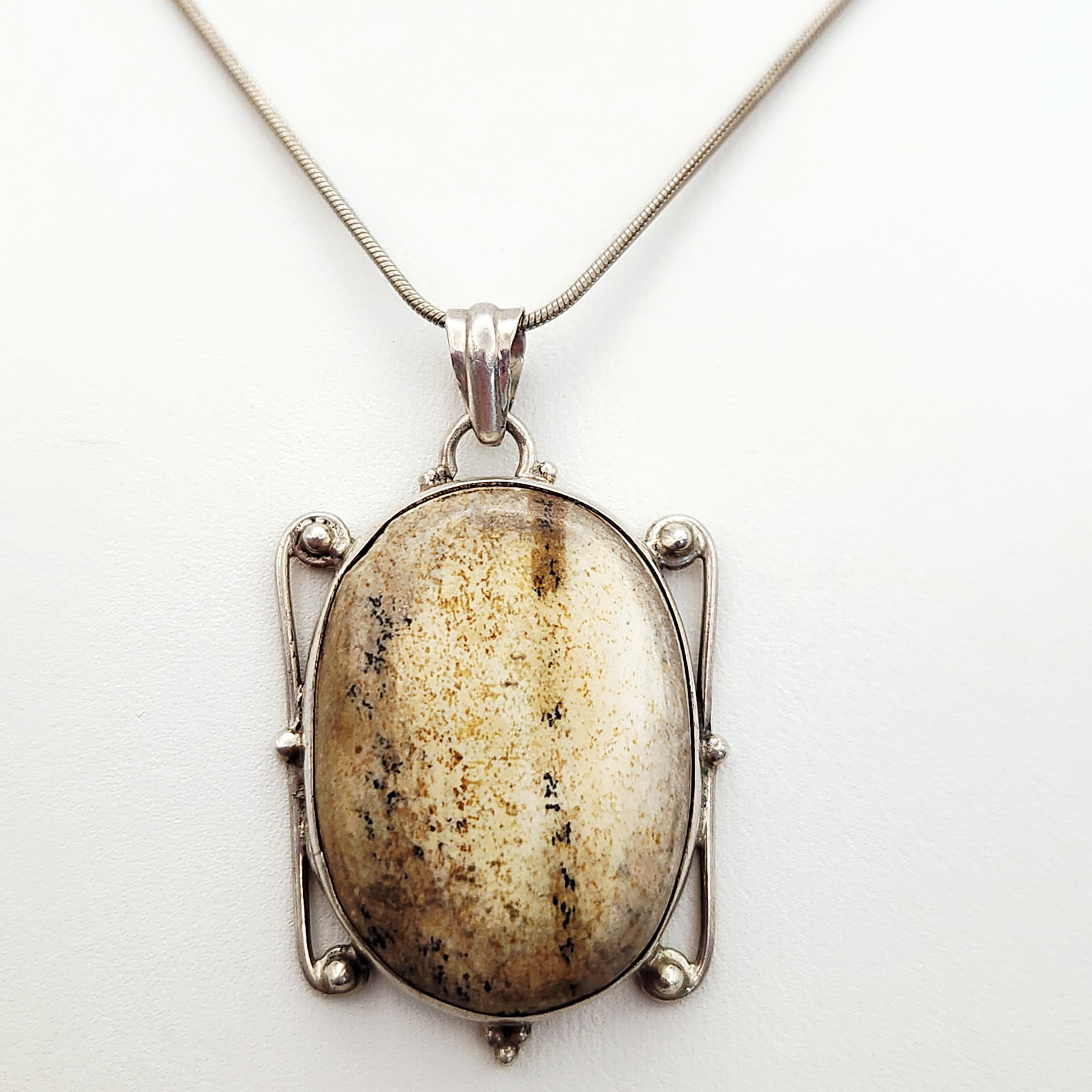 Karis Sterling Jasper Necklace 15.9 Grams: This necklace features a pendant bezel-set with a large, oval picture jasper. Metal marks include 925 and the Karis brand mark stamped on an attached tag, with an additional 925 mark on the clasp.
