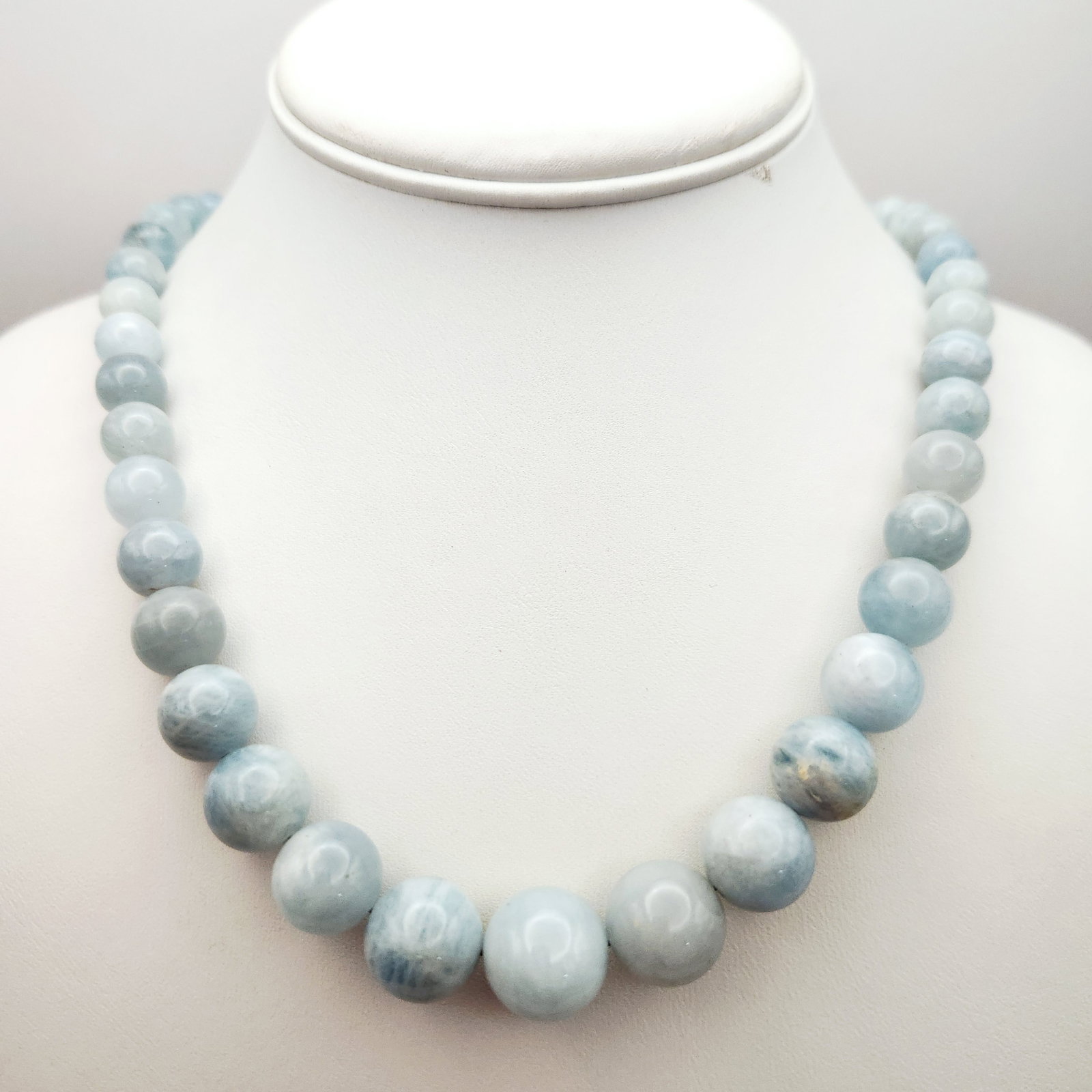 DRT Aquamarine Necklace Sterling Clasp: Jay King Desert Rose Trading featuring polished round aquamarine gemstone beads in shades of pale blue and light grey with natural mottling and inclusions. Length: 23 inches Bead diameter: approximate