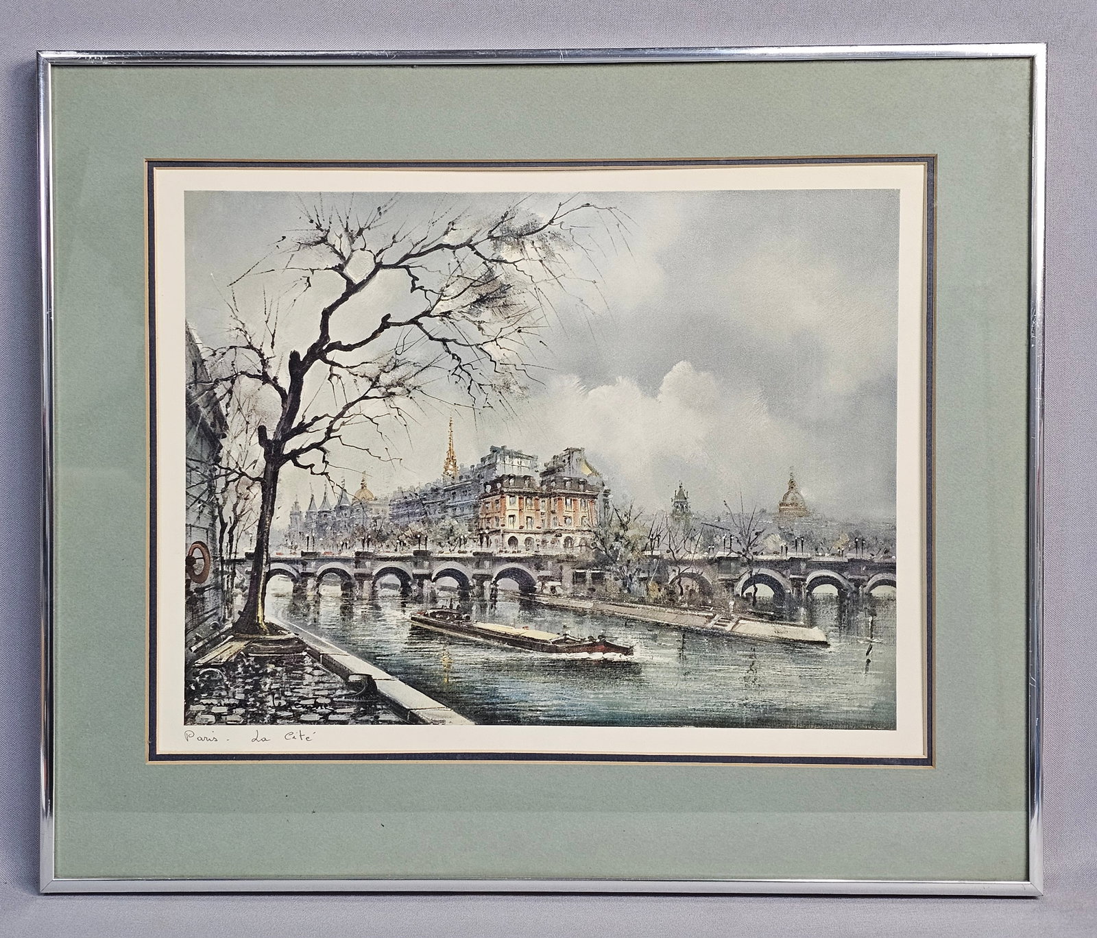 Framed Maurice Legendre Paris La Cafe Lithograph: Frame measures: 19 x 16 inches The artwork appears to be in very good condition. The colors are bright and show no significant signs of fading or light damage. The paper is flat with no visible