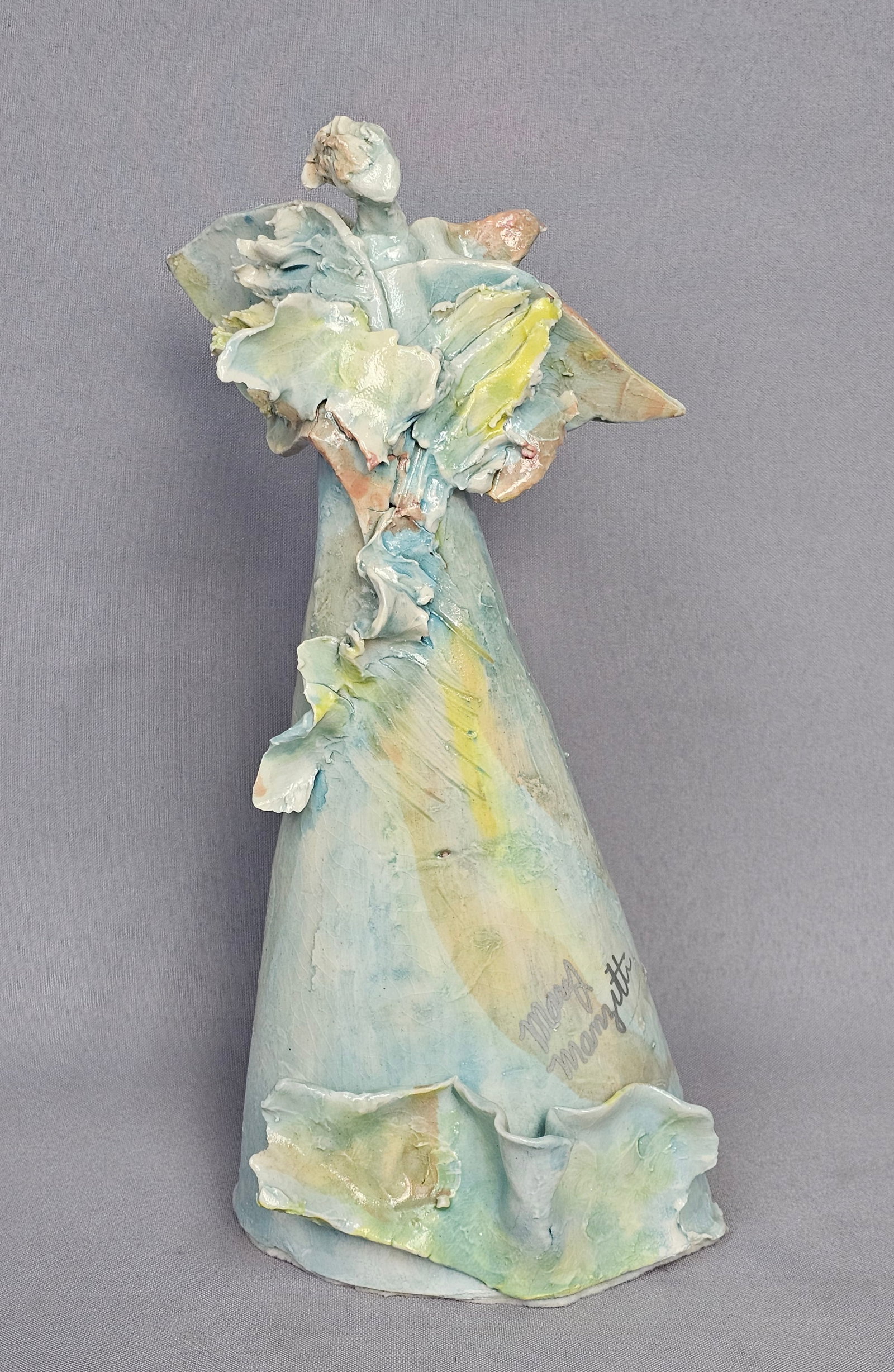 Mary Manzetti Signed Ceramic Angel Sculpture: An abstract figural ceramic sculpture by Mary Manzetti. The piece features a tall, tapered body with hand-formed, leaf-like ruffled applications at the shoulders and base, suggesting a stylized angel