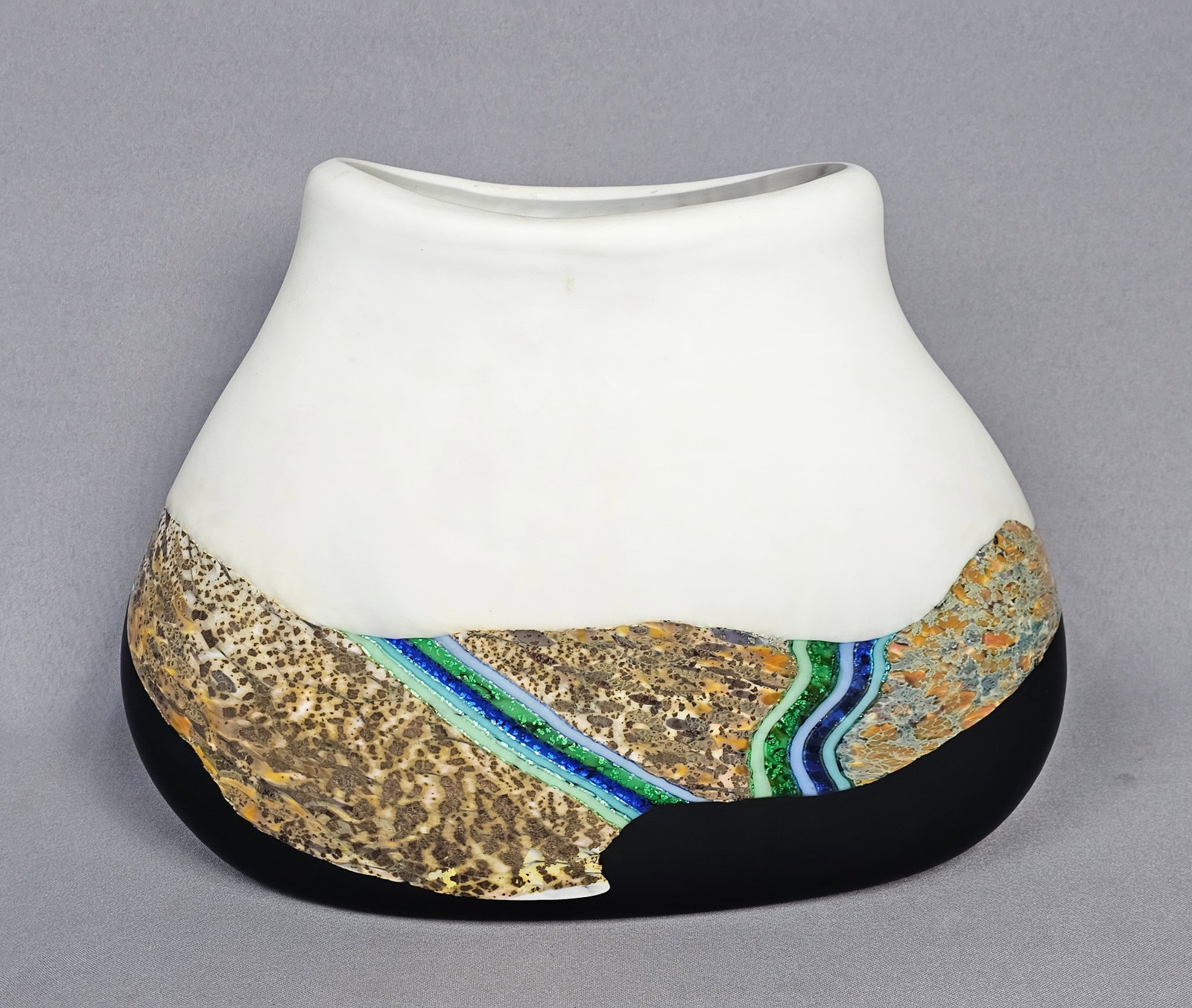 Studio Art Glass Landscape Pillow Vase: This large, hand-blown studio art glass vessel is crafted in a flattened pillow form with a wide, oval rim and a tripartite decorative scheme. The body is divided into three horizontal zones: an