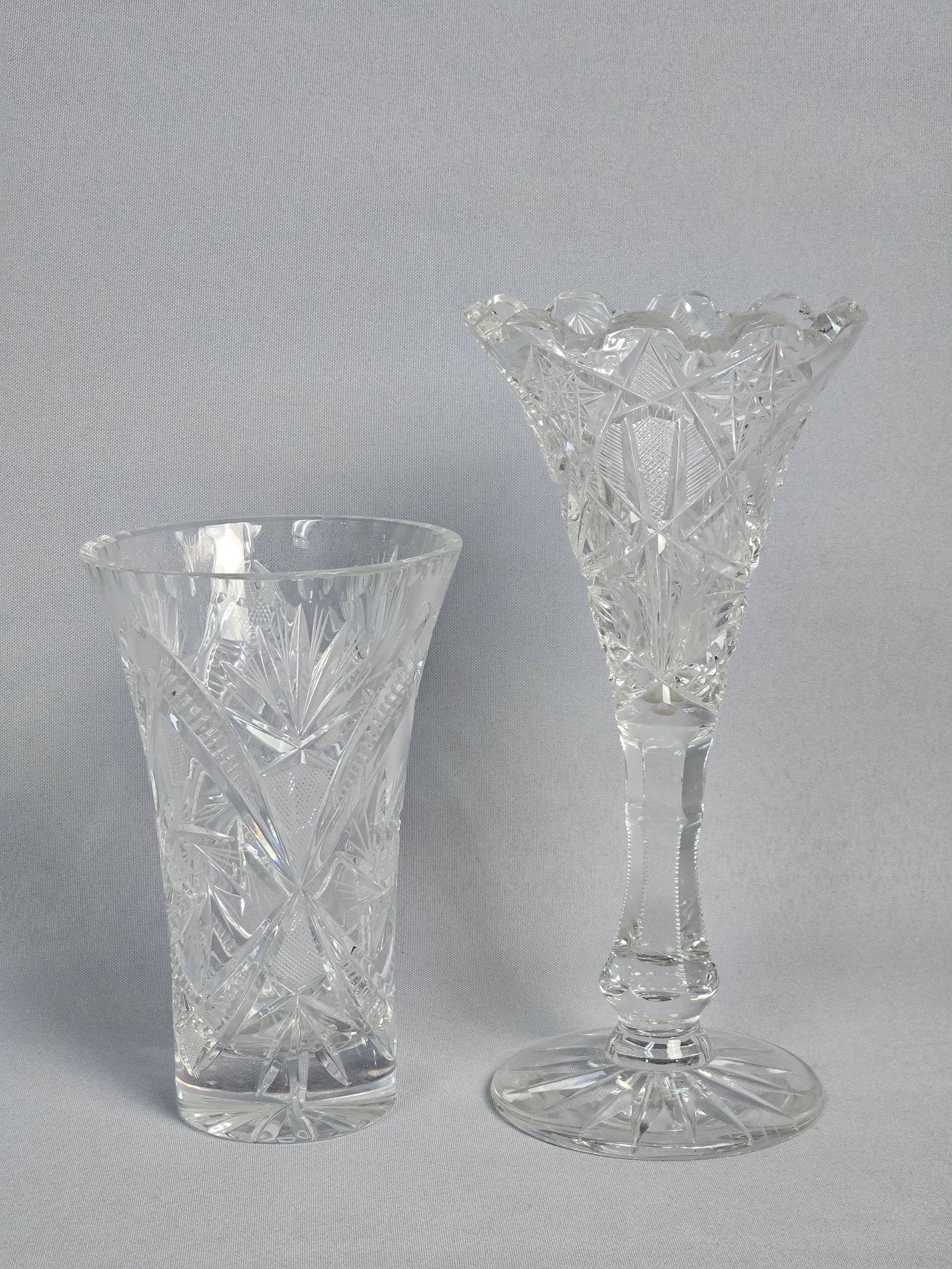 Two Pieces of American Brilliant Period Cut Glass: This lot features two pieces of heavy lead crystal from the American Brilliant Period, characterized by deep miter cuts and high clarity. The first item is a footed trumpet vase with a flared form and