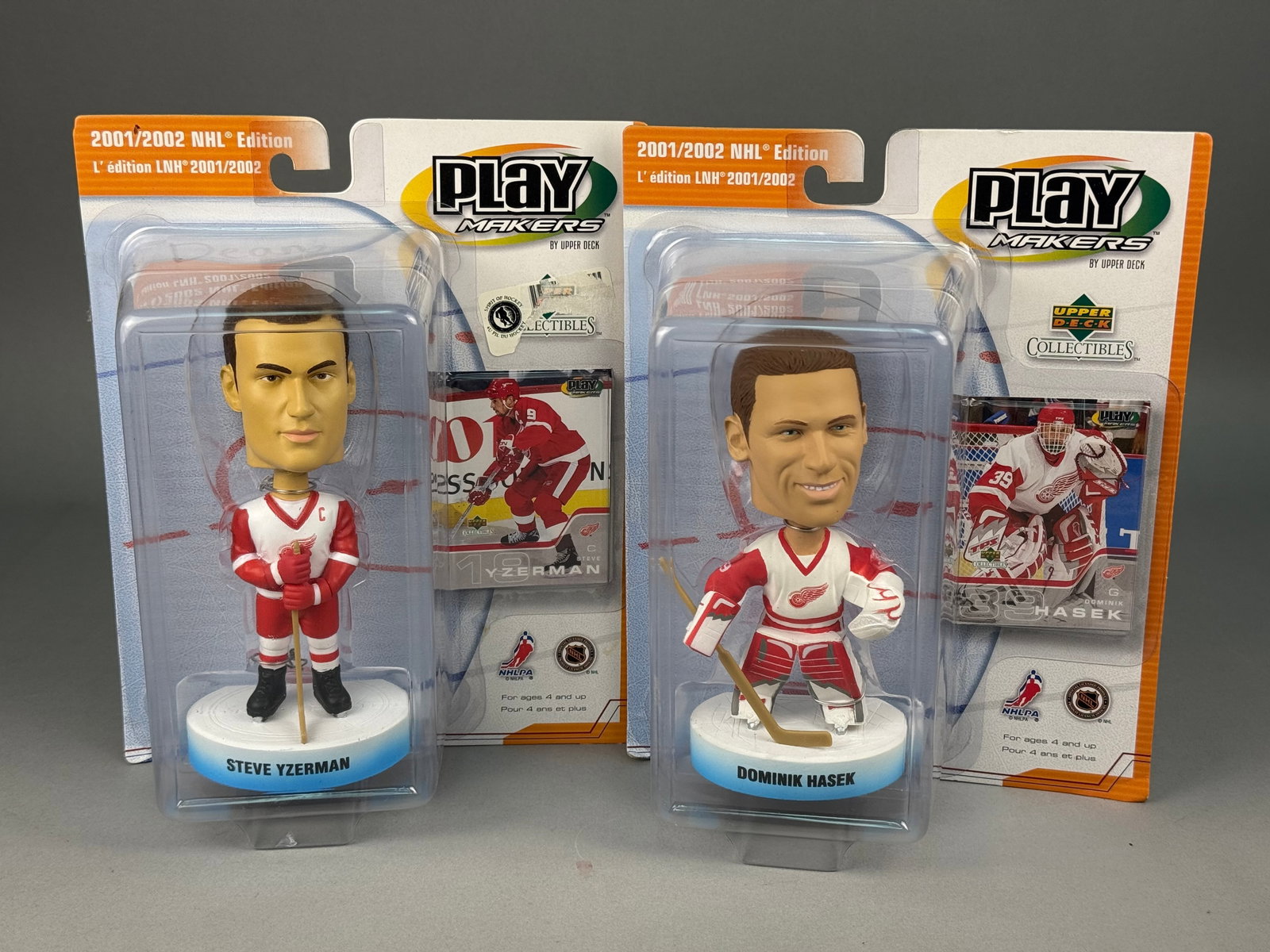 Upper Deck Playmakers NHL Bobblehead Figurines Detroit Red Wings Yzerman & Hasek: This set includes two key members of the Detroit Red Wings roster from the early 2000s: center Steve Yzerman and goaltender Dominik Hasek. The packaging consists of a clear plastic blister shell