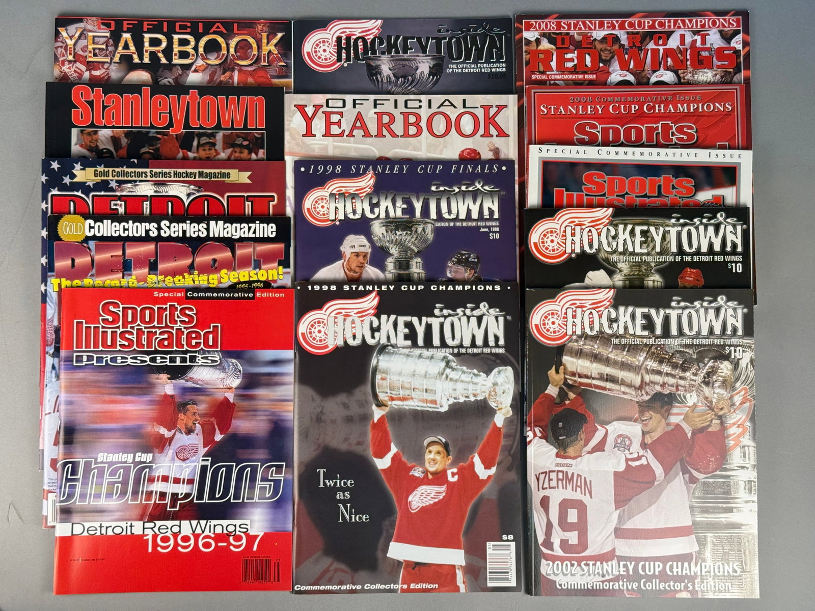 Detroit Red Wings Stanley Cup Championship Commemorative Magazines: This assortment of printed memorabilia documents the championship era of the Detroit Red Wings. The group includes multiple issues of Inside Hockeytown, focusing on the 1997, 1998, and 2002 Stanley