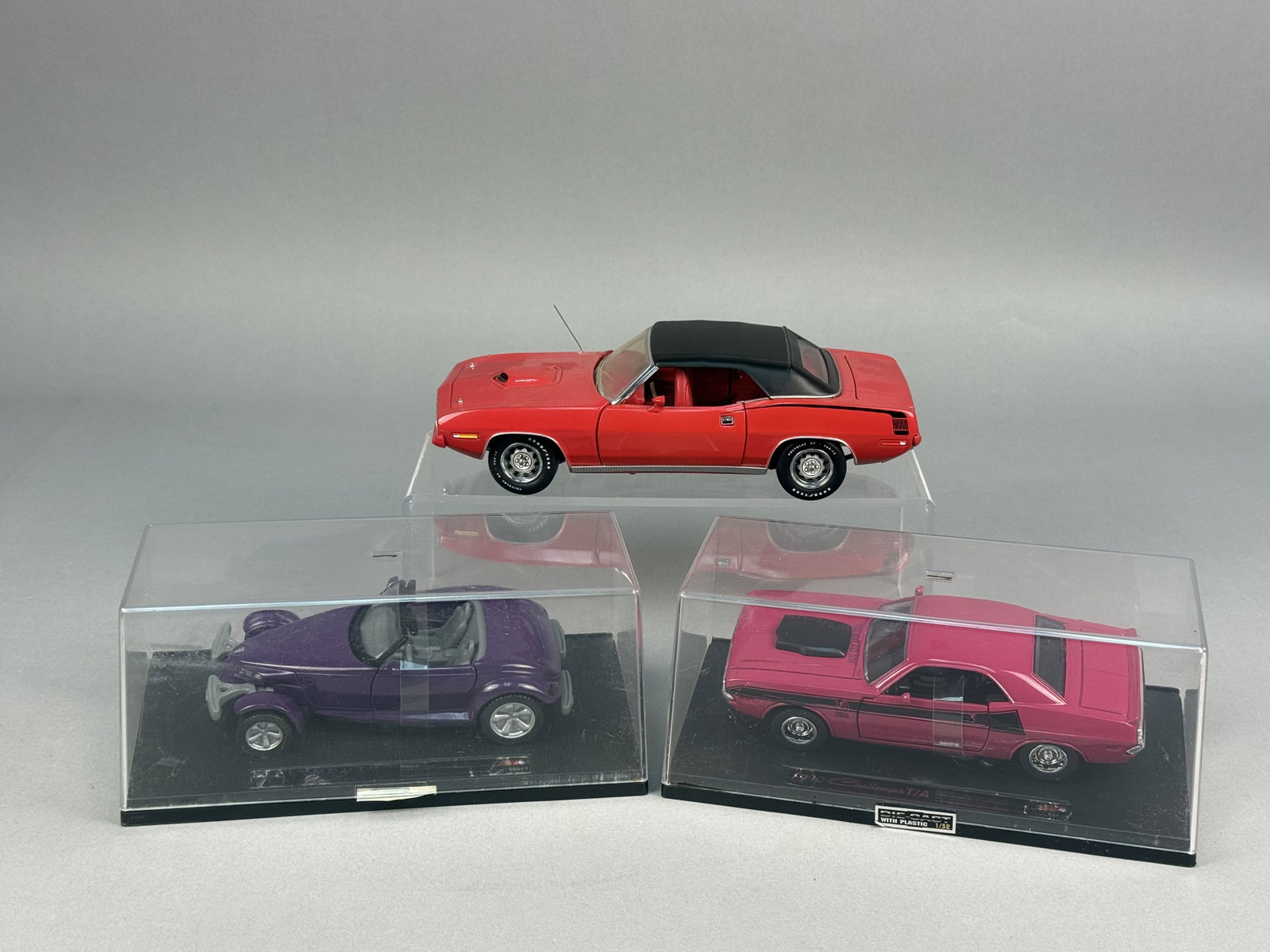 Three Die-Cast Model Cars Inc Franklin Mint 1970 Plymouth Hemicuda: The first is a 1970 Plymouth Hemicuda by Franklin Mint Precision Models. The chassis is embossed with the following text: 1970 PLYMOUTH HEMICUDA, The second model is a Plymouth Prowler roadster in met