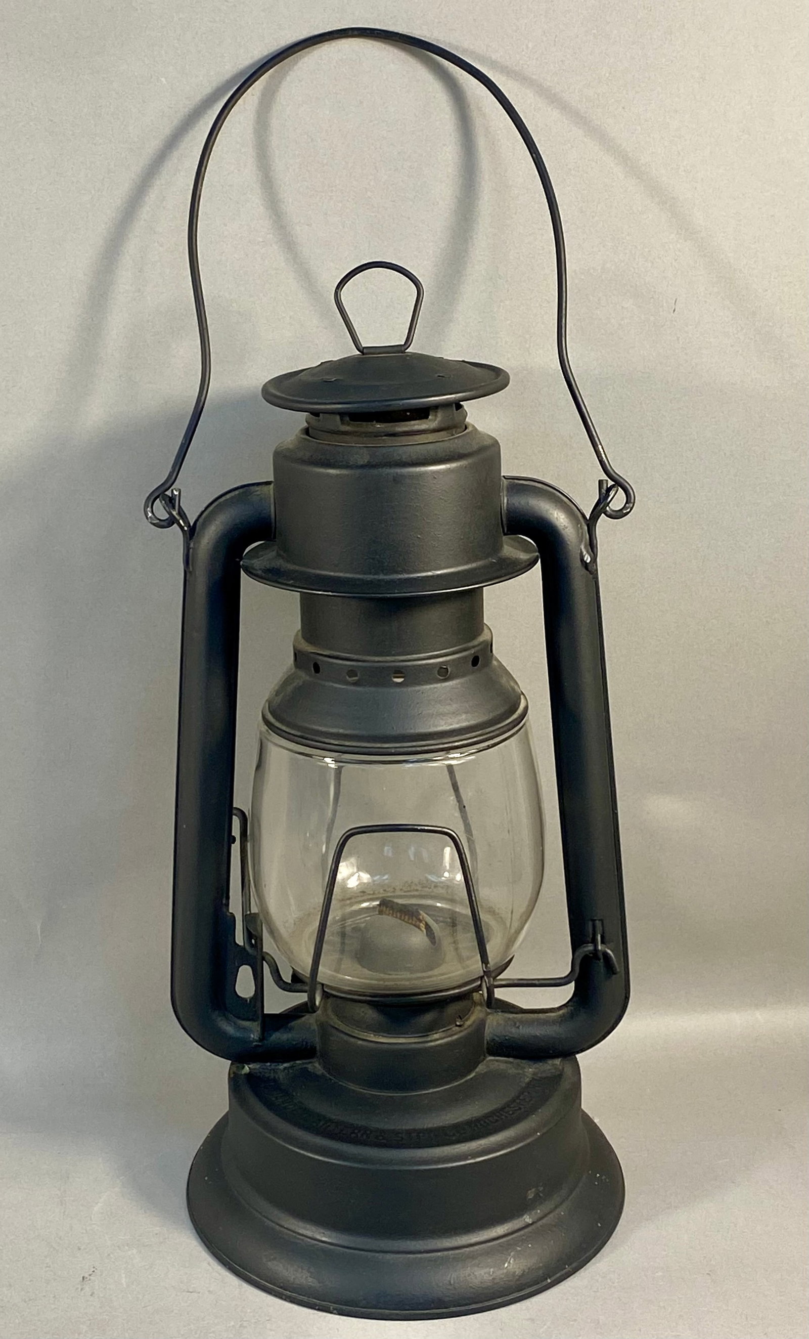 Defiance Lantern & Stamping Co. No. 2 Triumph Tubular Cold Blast Lantern: A Defiance No. 2 Triumph tubular cold blast kerosene lantern manufactured by the Defiance Lantern & Stamping Company in Rochester, New York. The lantern features a metal body, likely tin-plated steel,