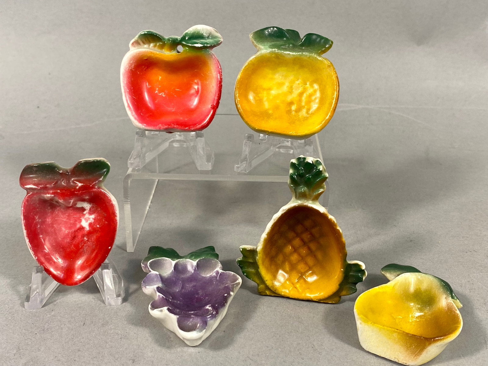 Six Vintage Davar Originals Ceramic Fruit-Shaped Salt Cellars: This set of six individual salt cellars was produced by Davar Originals in Japan during the mid-20th century. The collection is crafted from earthenware and features hand-painted and airbrushed
