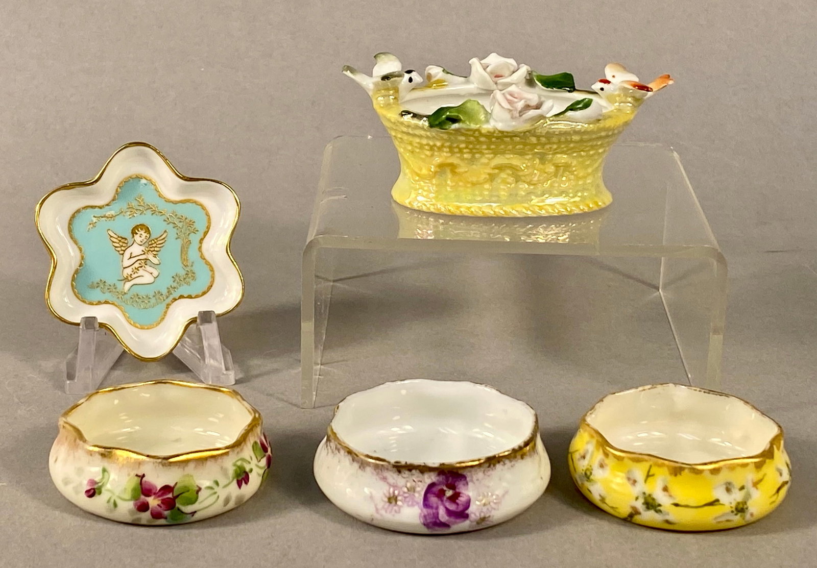 Decorative Porcelain and Bone China Items Inc Spode, Lenox: This collection comprises multiple pieces of fine decorative porcelain and bone china from notable manufacturers. The group includes a star-shaped Spode dish, a miniature German basket, and three flor