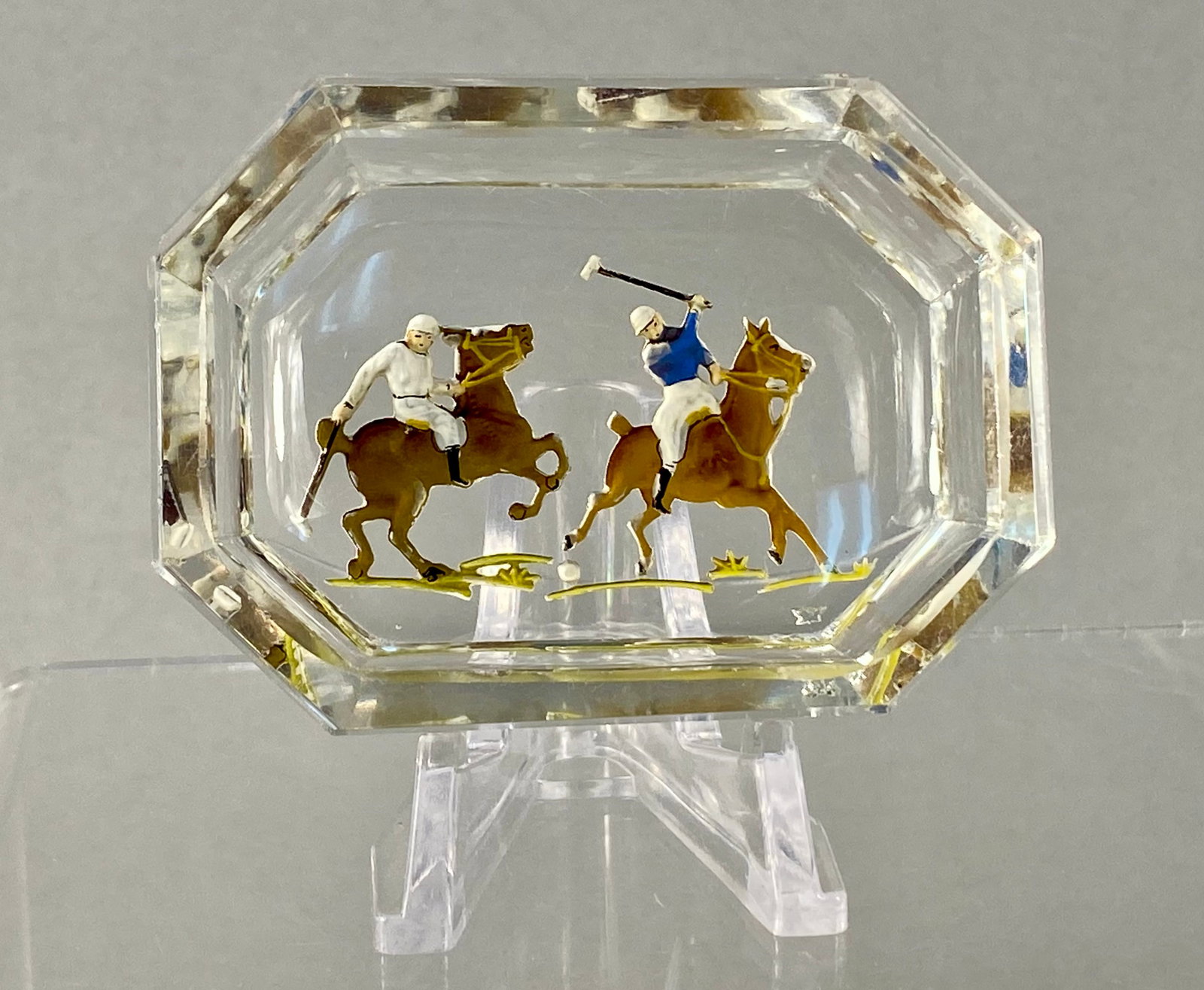 Heinrich Hoffmann Reverse Intaglio Polo Scene Salt Cellar: This octagonal glass salt cellar features a reverse intaglio sporting scene depicting two polo players on horseback in active pursuit of a ball. The piece is attributed to the Bohemian glassmaker Hein