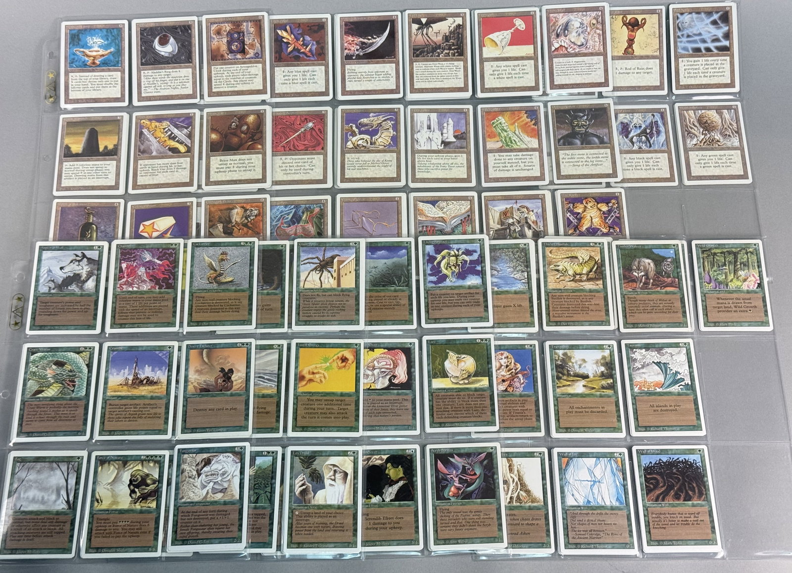 Magic: The Gathering Revised Artifact and Green Cards: This lot comprises a significant collection of Magic: The Gathering trading cards from the Revised Edition. Lot consists of Artifacts and Green cards. There are multiples (up to 4) of some cards.