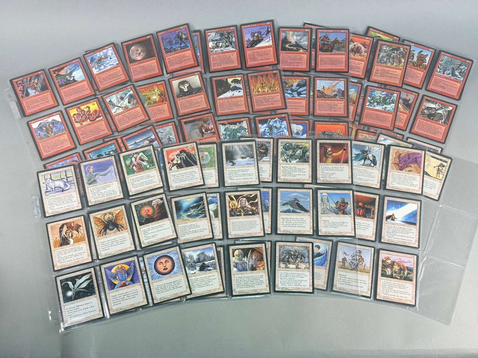 Magic The Gathering Ice Age Red and White Cards: A collection of Magic: The Gathering (MTG) trading cards from the Ice Age expansion set, released in 1995 by Wizards of the Coast. The assortment is primarily composed of red and white color-profiled 
