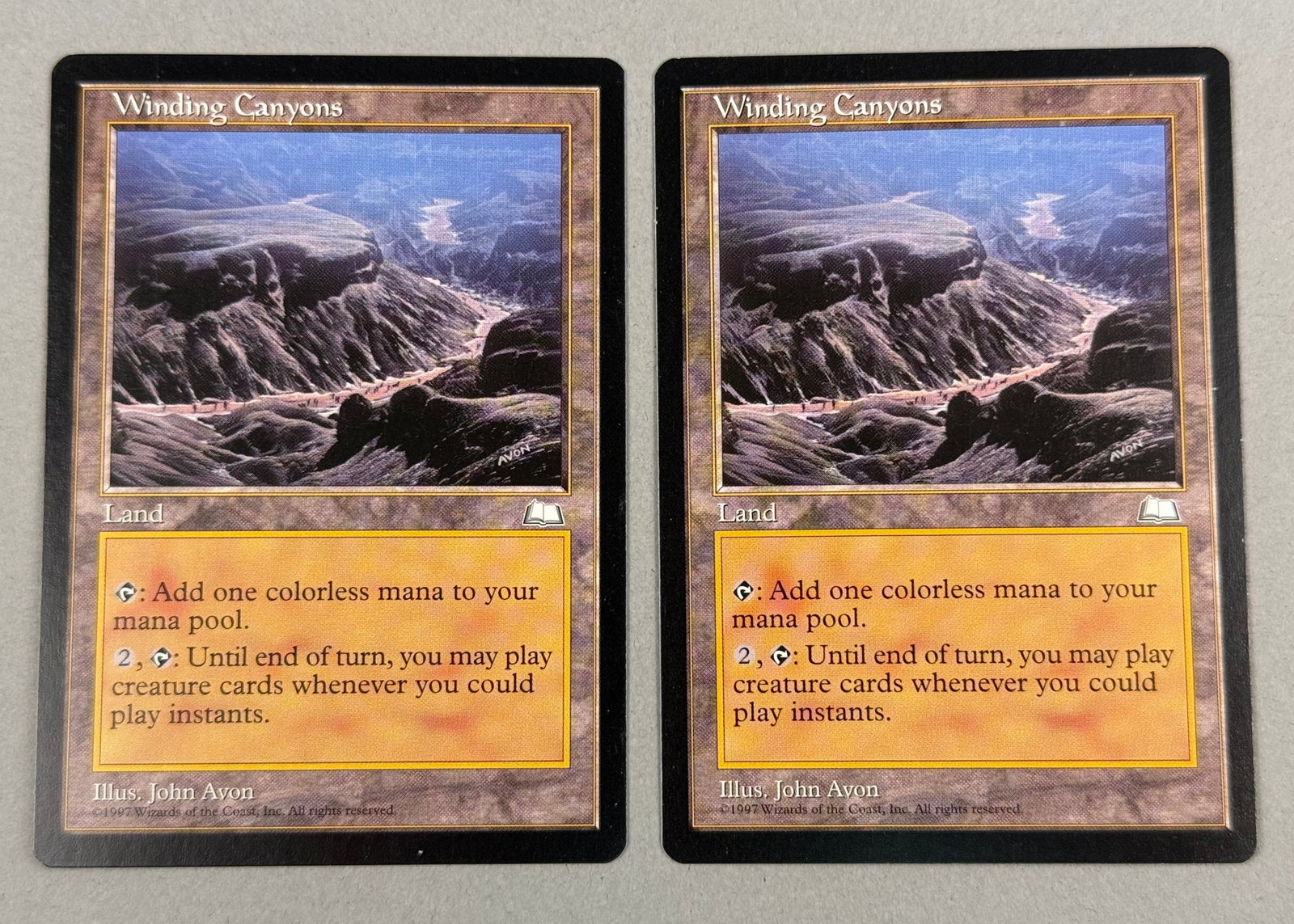 2 Magic: The Gathering Winding Canyons Weatherlight: This lot contains two original Magic: The Gathering trading cards titled Winding Canyons from the Weatherlight expansion set, released in 1997. The bottom copyright line states "Â©1997 Wizards of