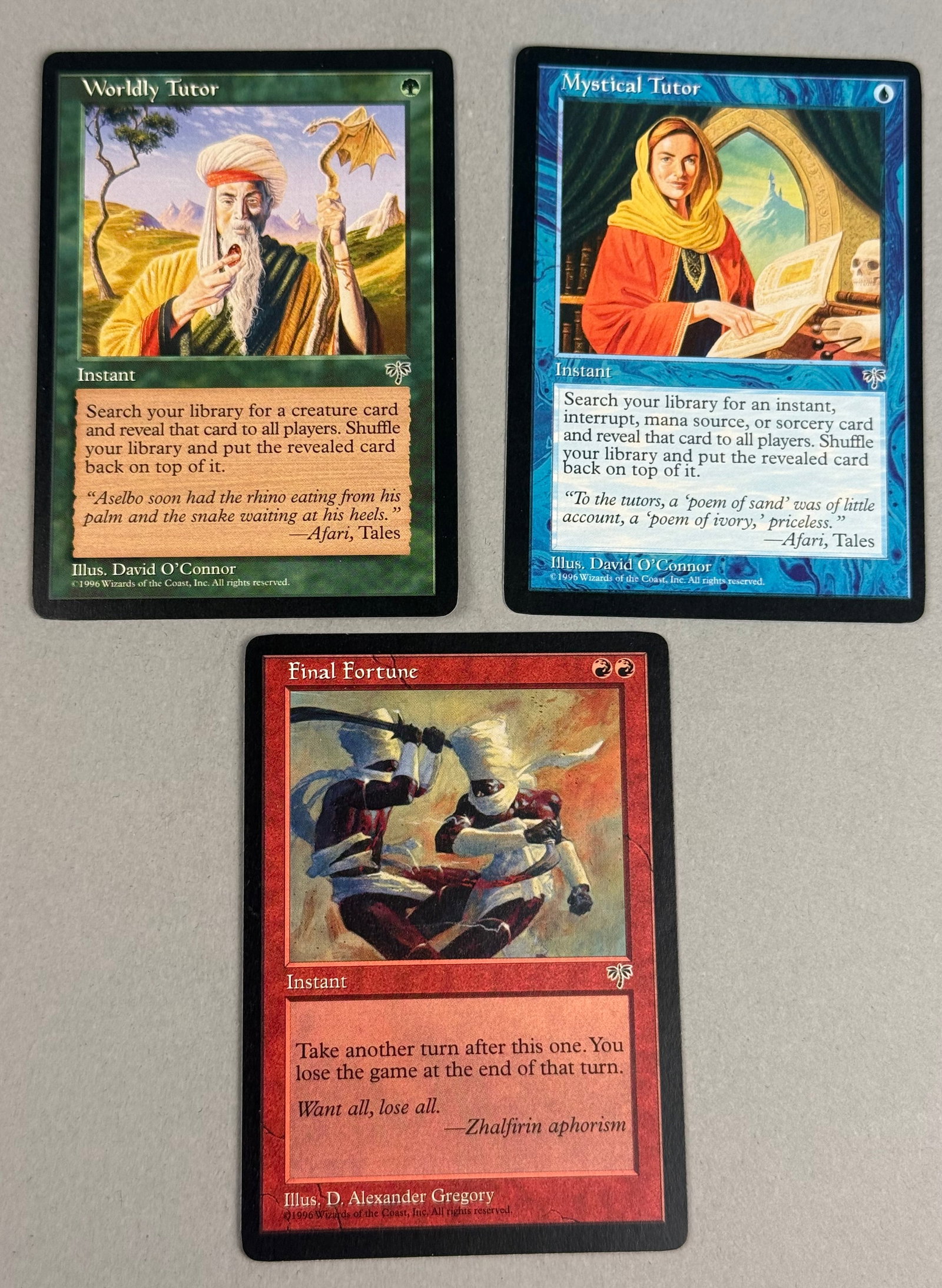 3 Magic: The Gathering Mirage Cards: This lot consists of three original Magic: The Gathering trading cards from the Mirage expansion set, released in 1996. The collection features one blue Mystical Tutor, one green Worldly Tutor