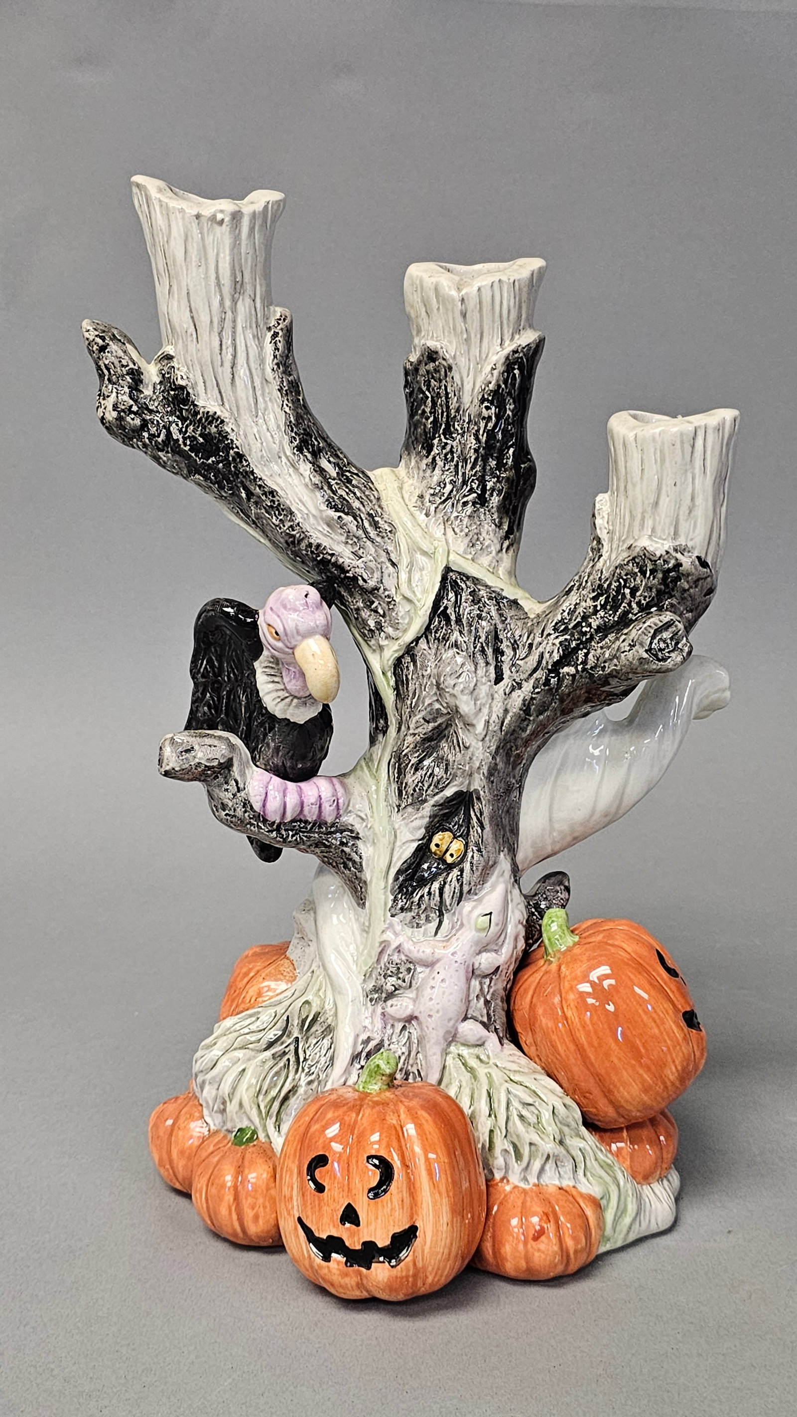Fitz and Floyd Halloween 3-Branch Spooky Tree Candleholder: This Fitz and Floyd glazed ceramic three-branch candleholder is part of the 1988 Halloween collection. The piece is modeled as a gnarled, spooky tree trunk with three wood-grain textured candle cups