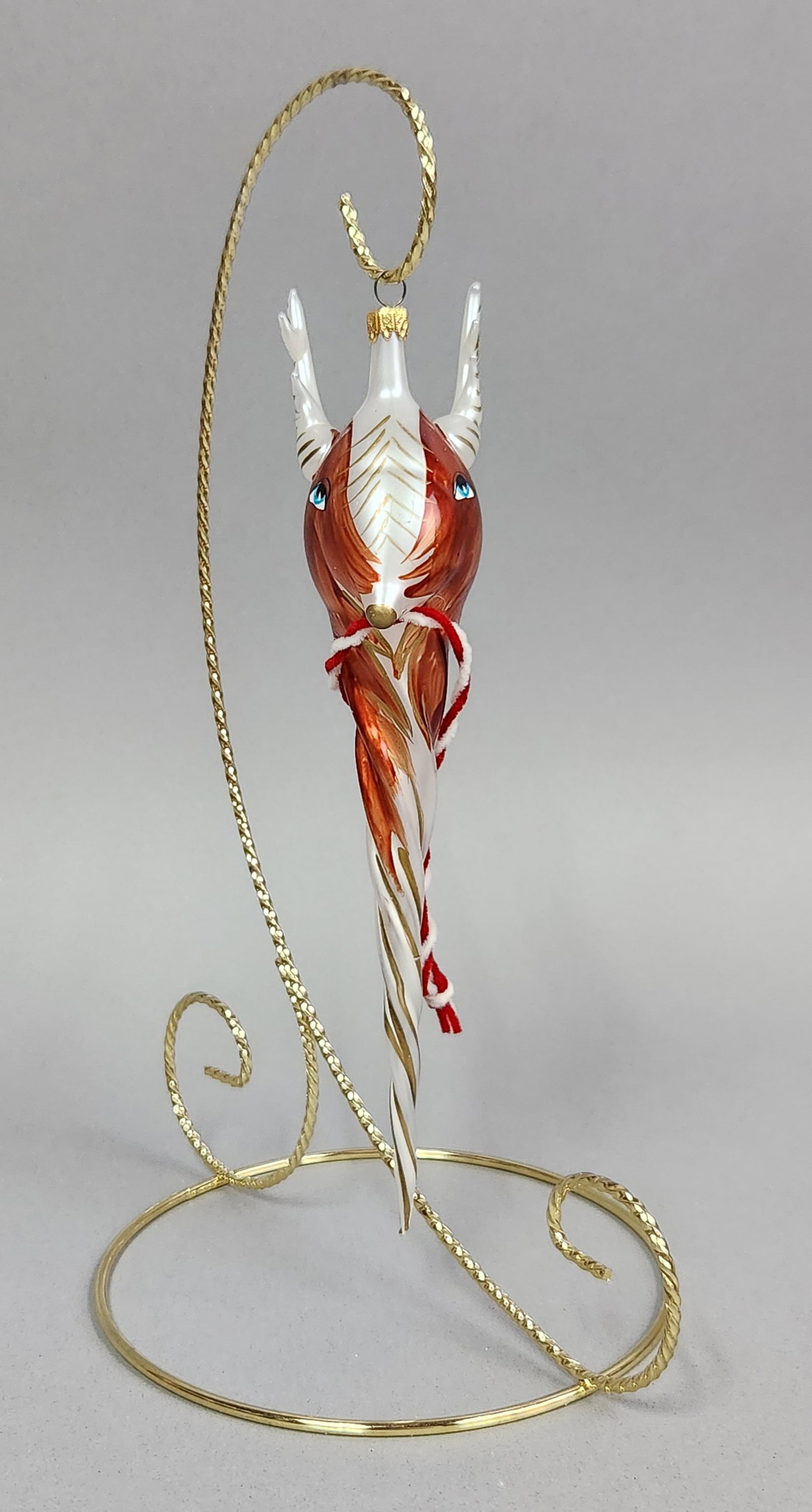 Soffieria De Carlini Glass Reindeer: Stand not included. This hand-blown glass Christmas ornament is produced by the Soffieria De Carlini studio in Italy. Length: 7.5 inches. The ornament is in good overall condition. No chips, cracks,