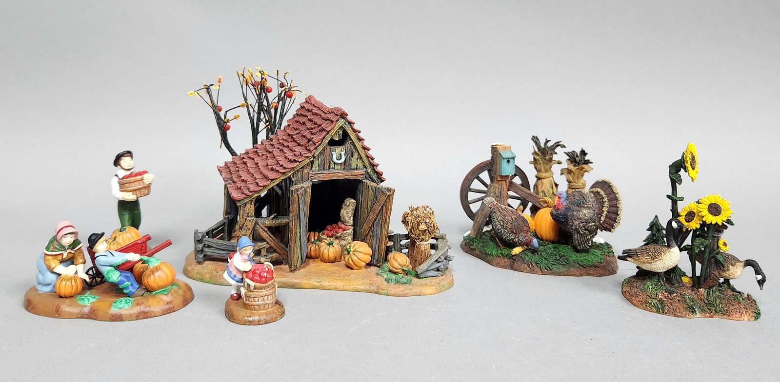 Dept 56 Thanksgiving Accessories: This lot features two sets of resin figurines and accessories from the Department 56 New England Village Series. The first set is titled It is Almost Thanksgiving (item number 56.56639). The second se