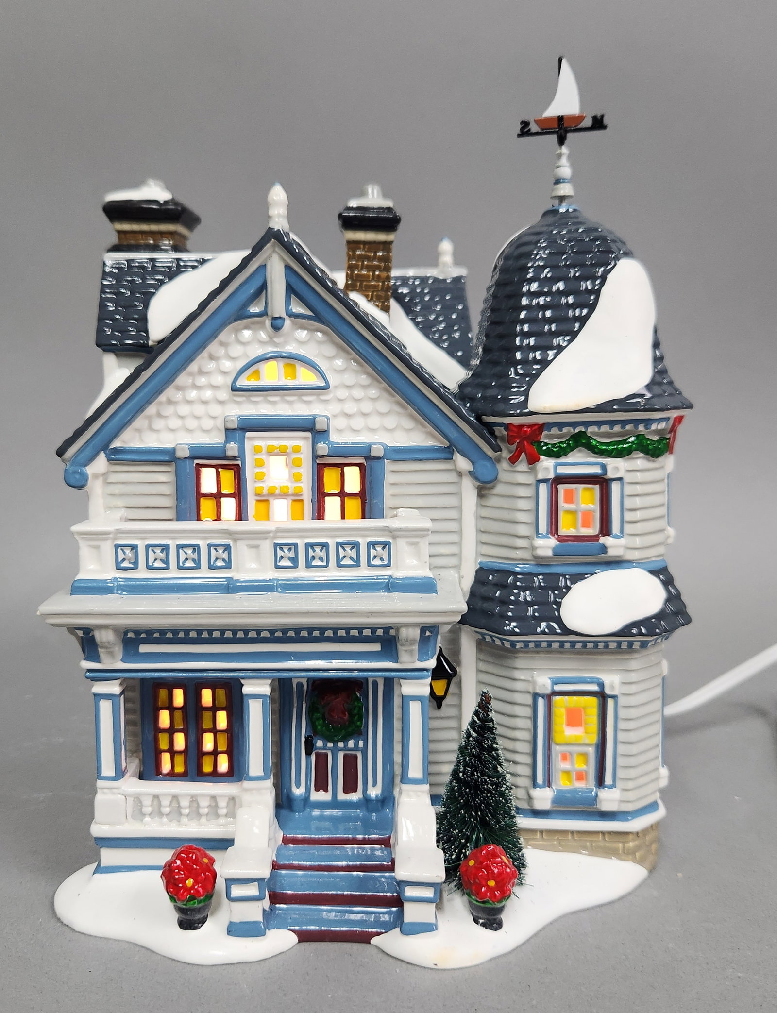 Dept 56 Elmwood House #56.55398: A Department 56 Elmwood House lighted ceramic building featuring a Victorian design with snow details and original box, measuring approximately 8.5 inches tall. Good working condition.