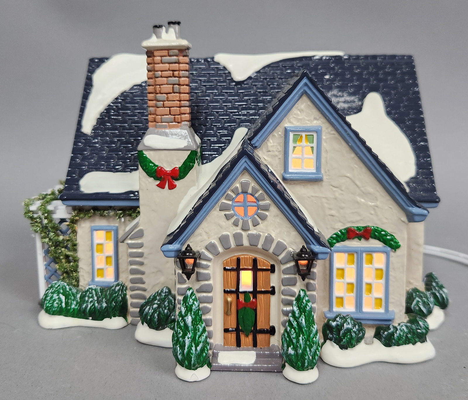 Dept 56 Hidden Ponds House: Department 56 The Original Snow Village Hidden Ponds House, model number 54944. Width: Approximately 8 inches. The ceramic house shows no visible chips, cracks, or repairs. Paint remains vibrant with