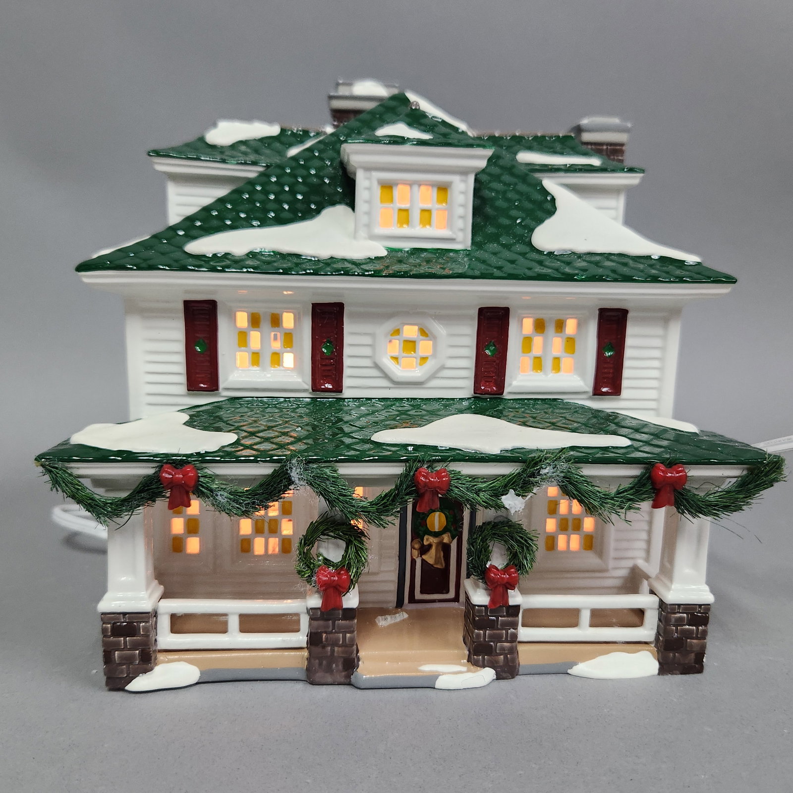 Dept 56 Crosby House: Department 56 Snow Village Crosby House #55056. A white power cord is provided. Width: Approximately 7.5 inches. Used. The porcelain structure shows no visible chips, cracks, or repairs. There is mino