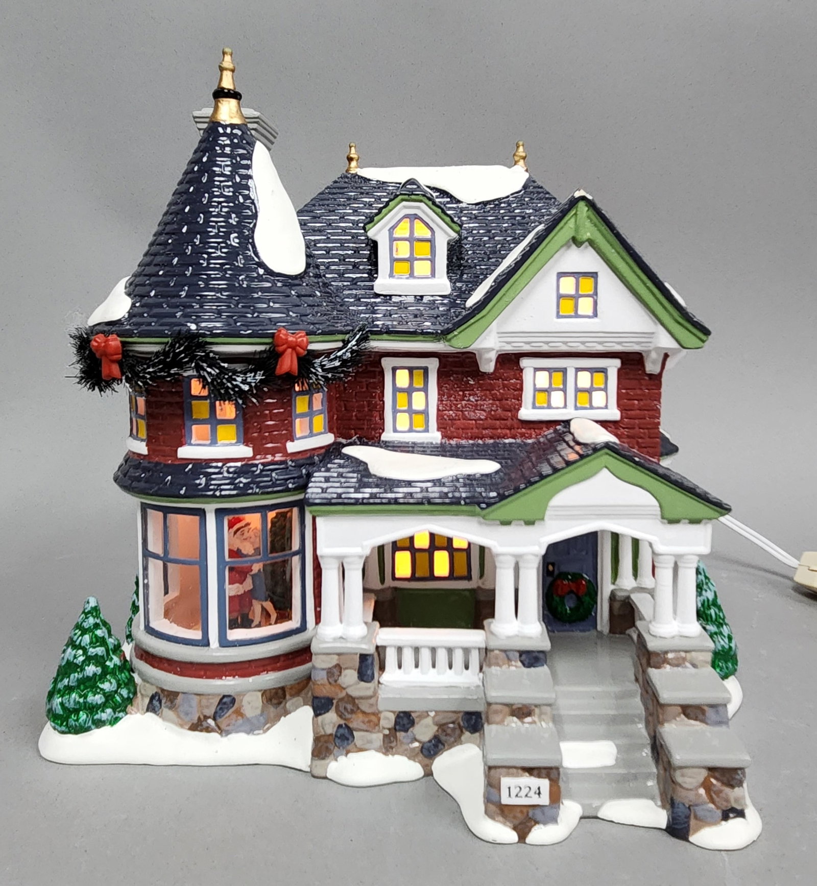 Dept 56 1224 Kissing Claus Lane: A Department 56 Original Snow Village 1224 Kissing Clause Lane #55091 measuring approximately 8.5 inches in height Overall good condition.