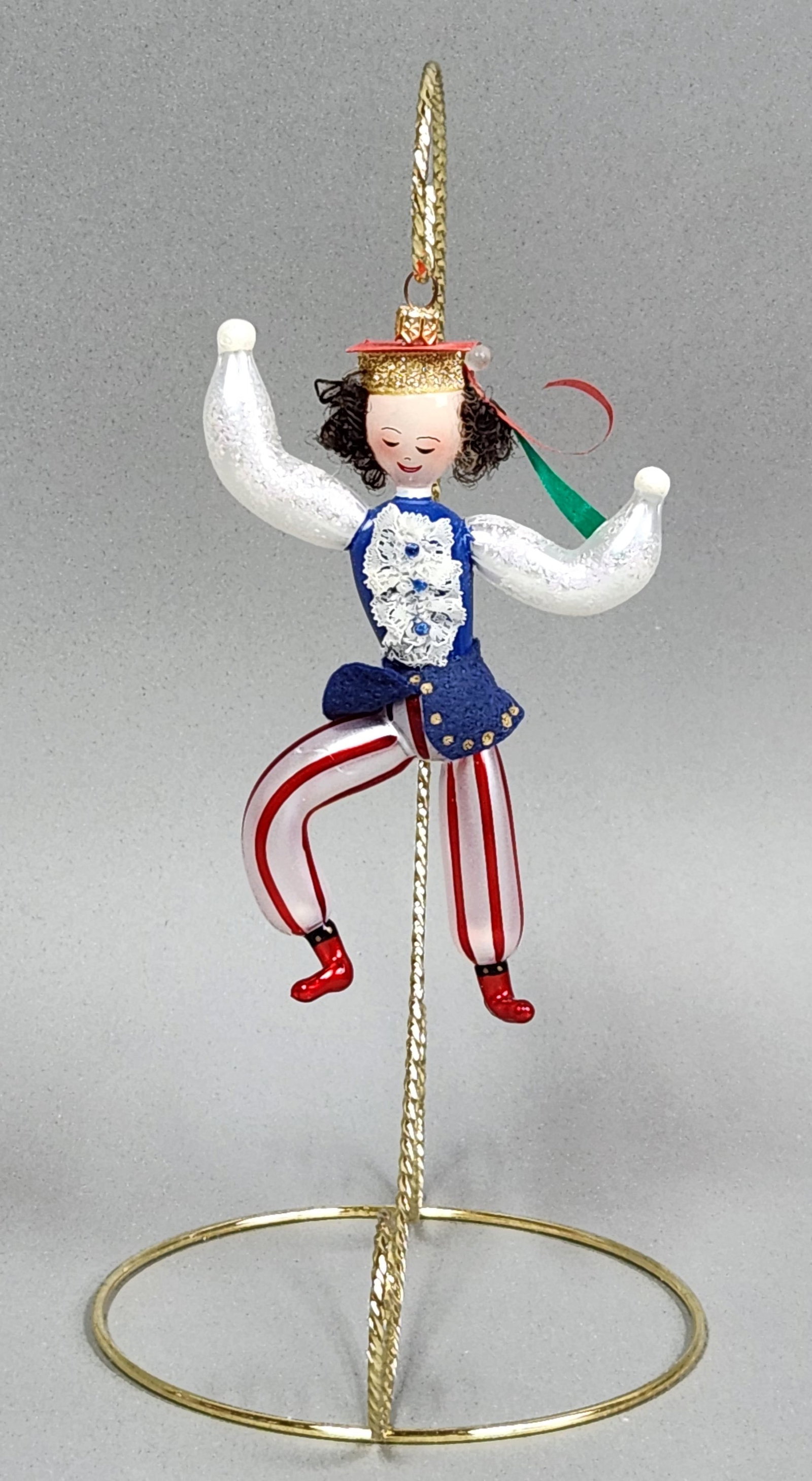 Christopher Radko Dancer Ornament: Stand not included. A whimsical hand-blown glass Christmas ornament depicting a dancer measuring approximately 6 inches long. Very good condition.