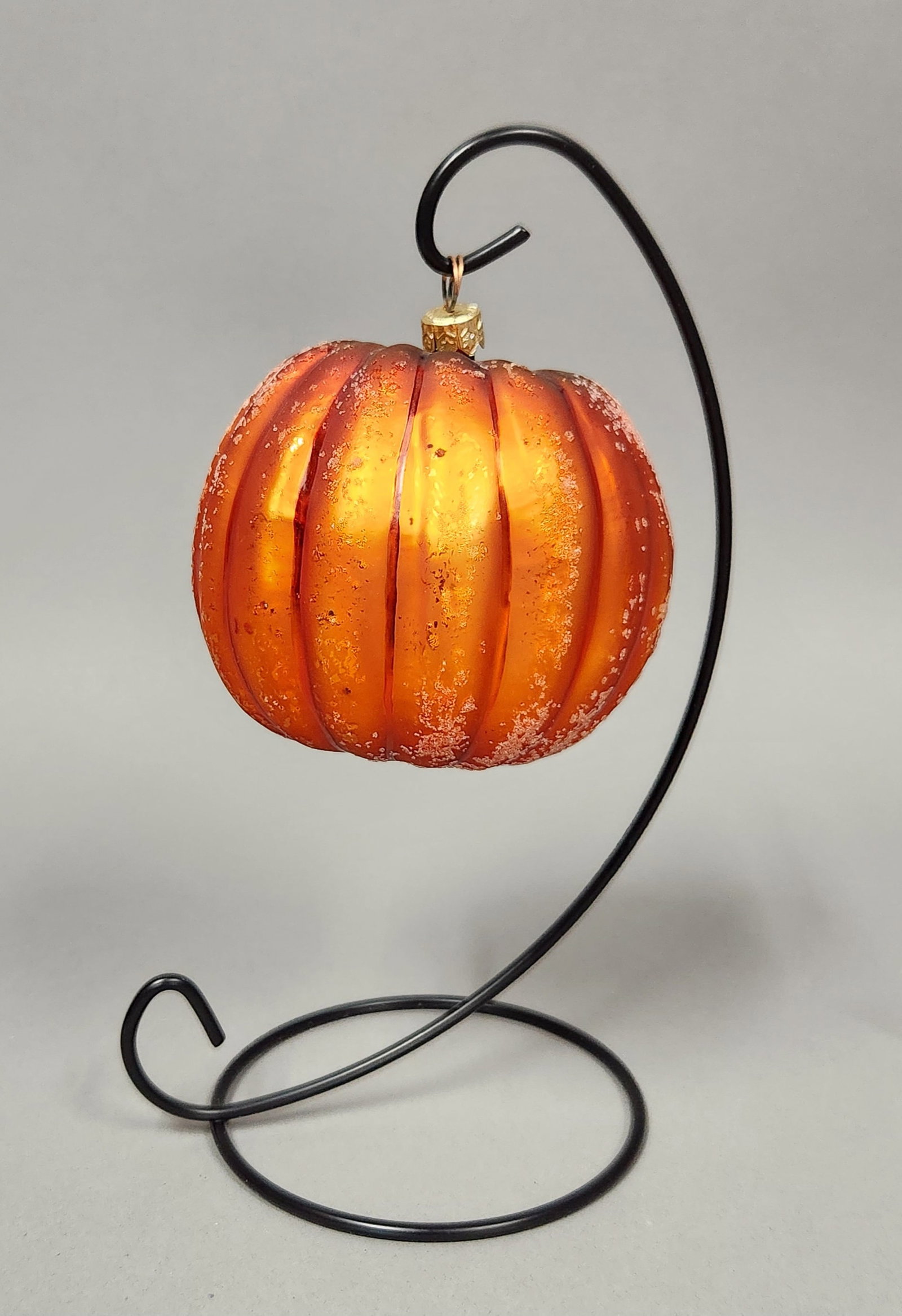 Christopher Radko Pumpkin Ornament: Stand not included. Christopher Radko frosted orange glass pumpkin ornament measuring approximately 3.5 inches in diameter. Very good condition.
