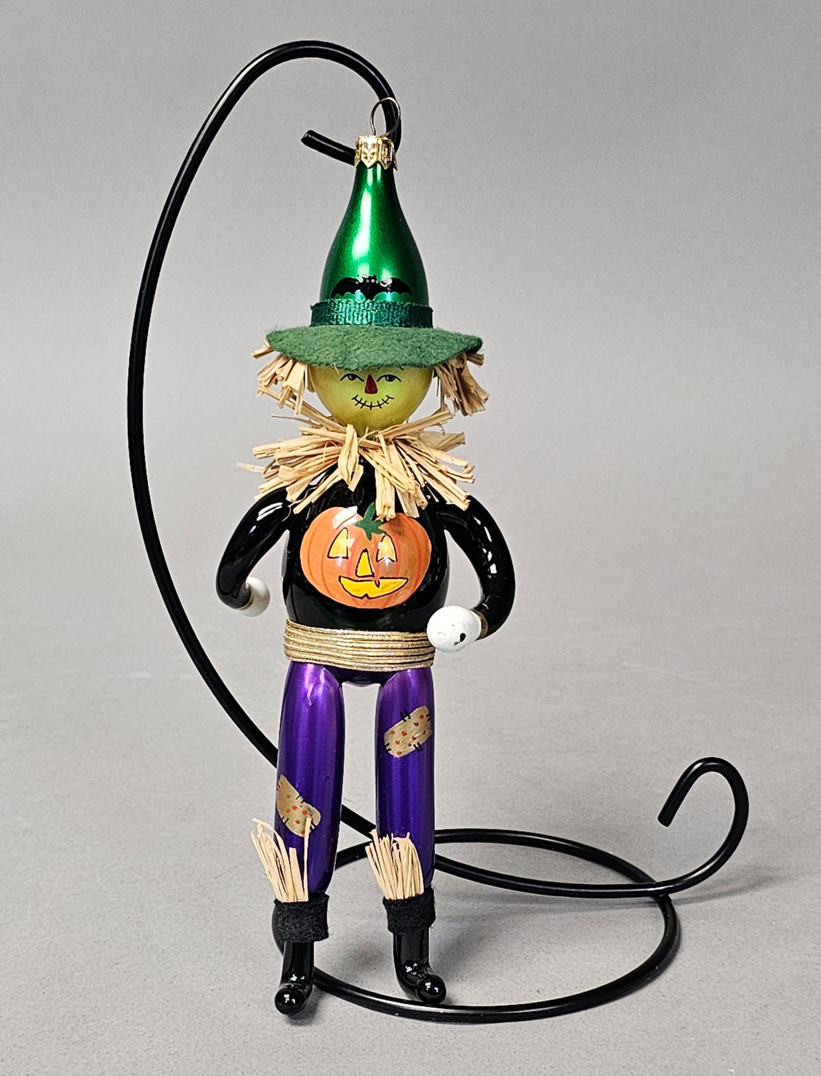 Radko Hand-Blown Glass Scarecrow Ornament: *STAND NOT INCLUDED* This hand-blown glass ornament is attributed to Christopher Radko, specifically the Field Friend design from the late 1990s. The whimsical figure is constructed from several mouth