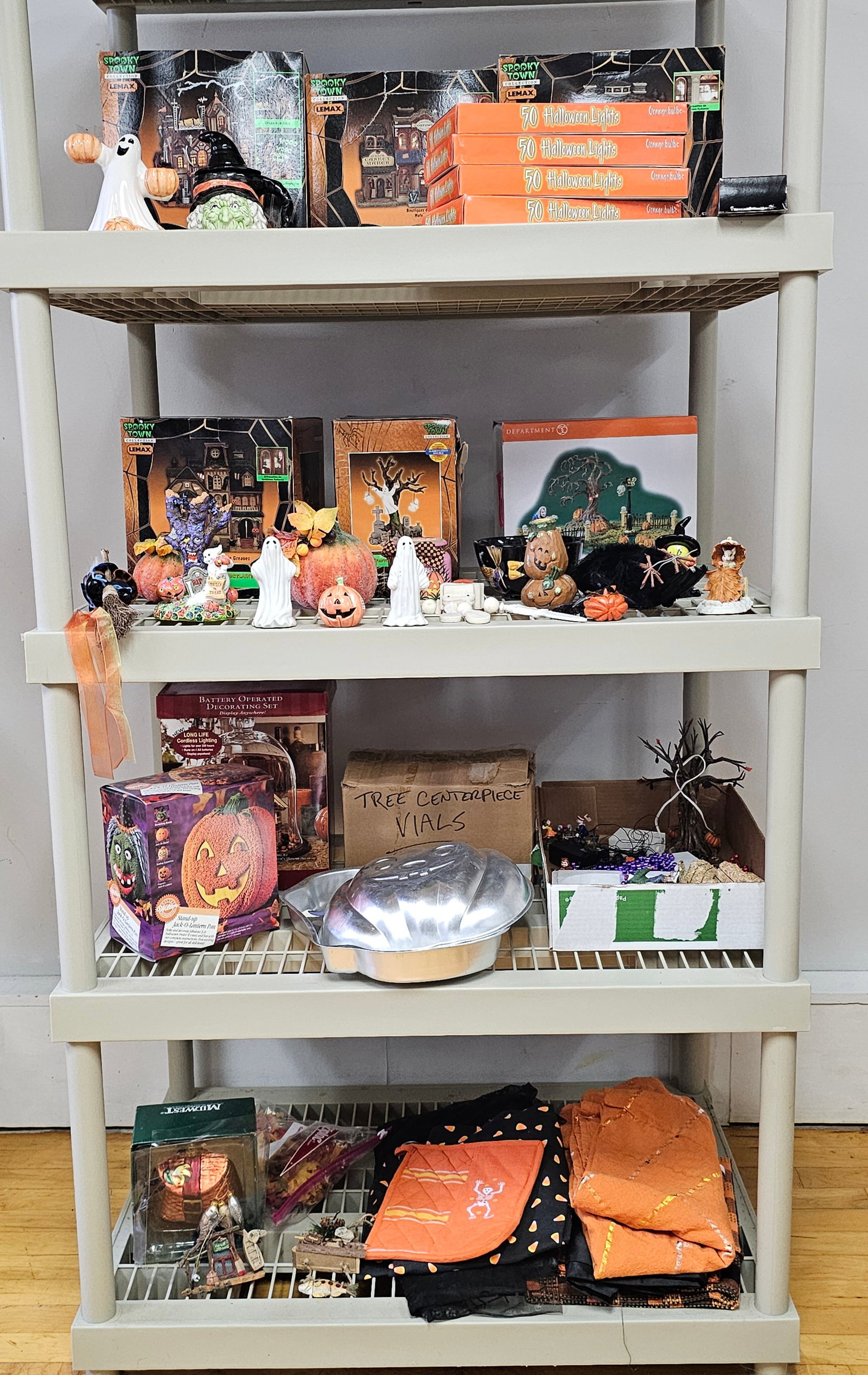 An Assortment of Halloween Collectibles including Lemax Spooky Town Department 56 and Wilton (1 of 9)