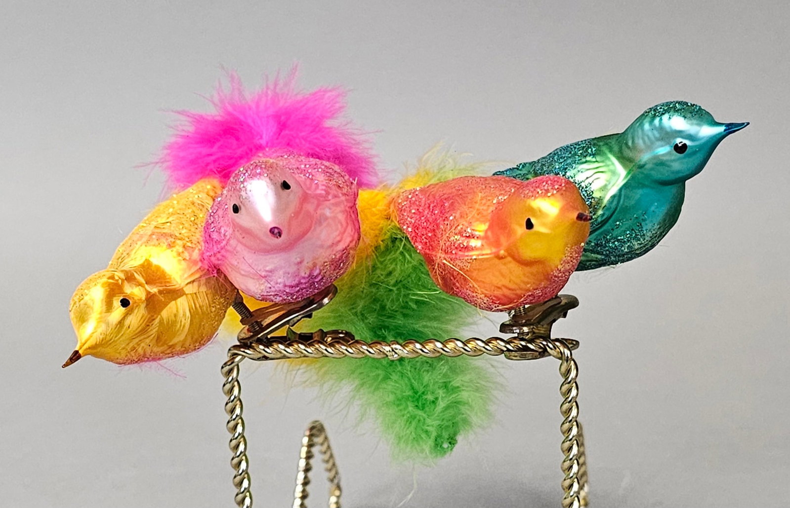 Pair of Mouth-Blown Glass Clip-On Bird Ornaments: *STAND NOT INCLUDED*This collection features mouth-blown glass bird ornaments designed with integrated mounting clips. Each bird is crafted from thin glass with an iridescent exterior finish in