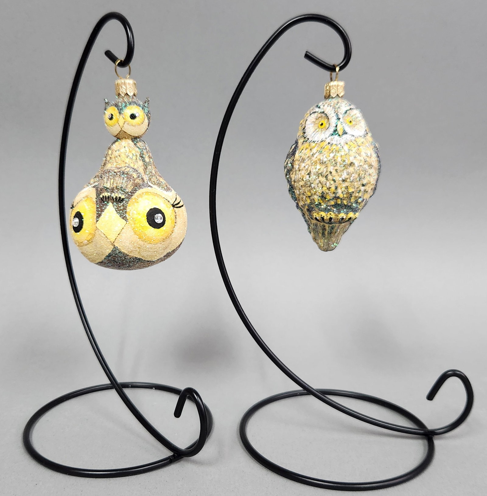 Glittered Glass Owl Ornaments: Stands not included. A pair of glittered glass owl Christmas ornaments, including one with a double owl design and rhinestone eyes, measuring approximately 3.25 to 3.5 inches in height. Very good cond