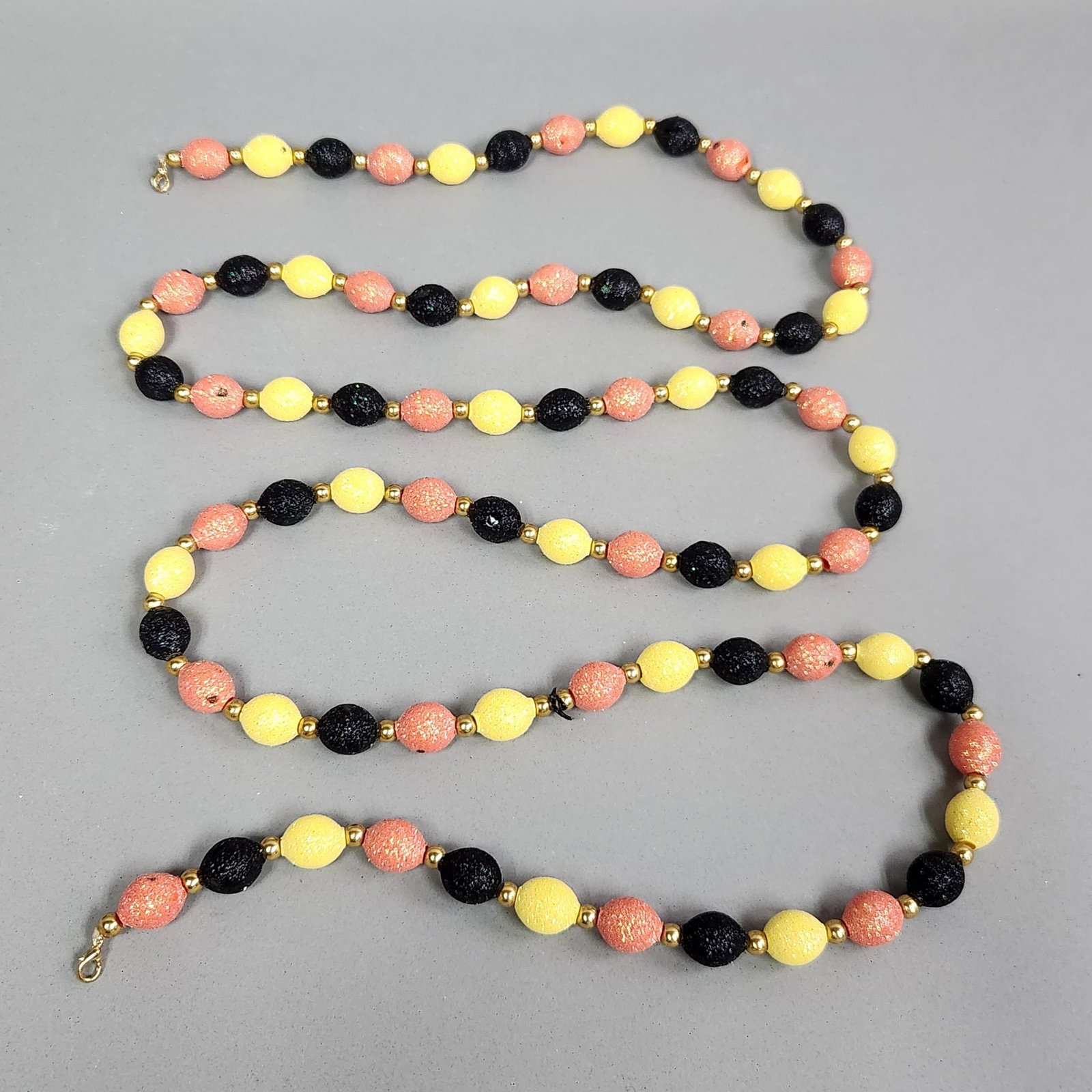 Patricia Breen Halloween Garland: Patricia Breen glass bead Garland. Length: 75" Some of the beads were stuck together resulting in some of the glitter missing on some of the beads.