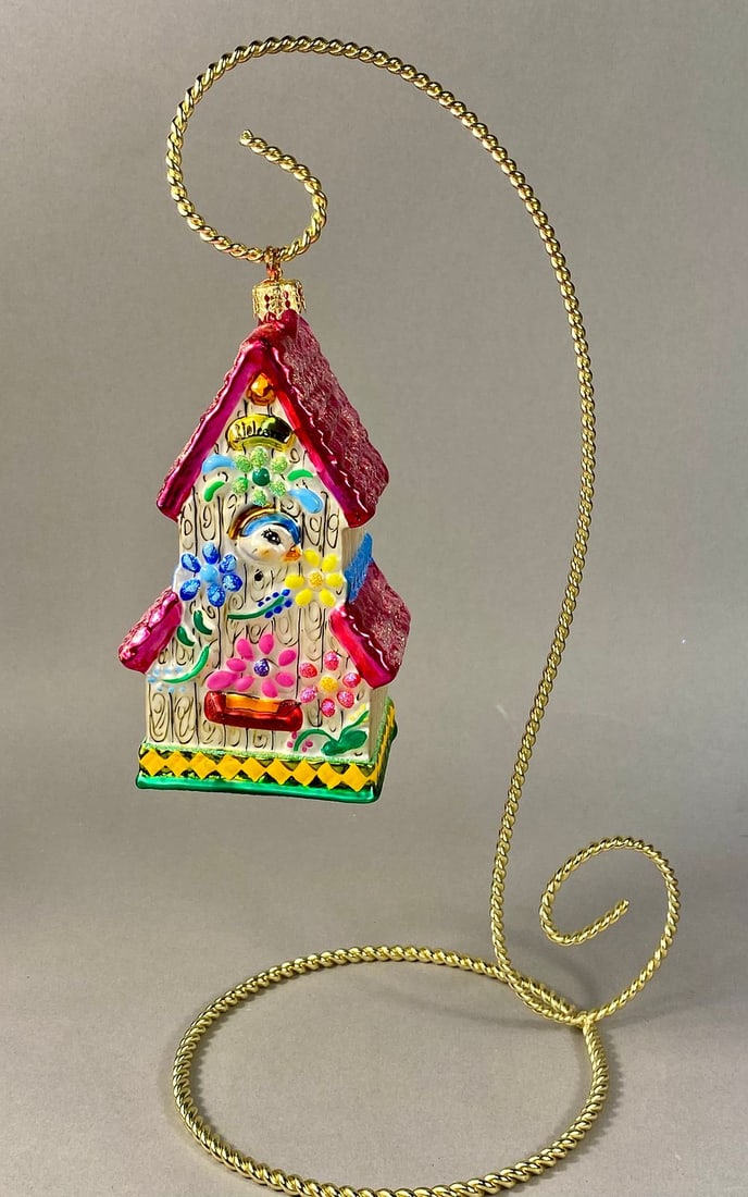 Radko Bluebird Suite Blown Glass Birdhouse Ornament: *STAND NOT INCLUDED* This is a mouth-blown, hand-painted glass holiday ornament produced by Christopher Radko, the Bluebird Suite pattern. The ornament is modeled as a multi-gabled birdhouse with a sm