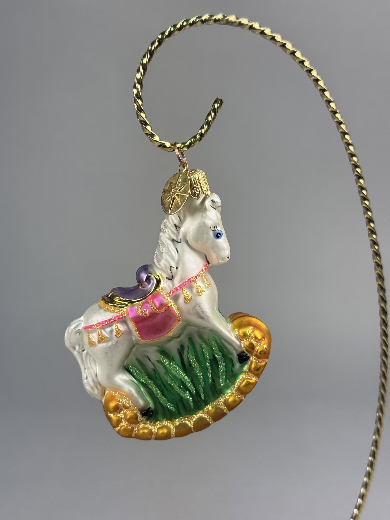 Radko Little Gem Collection Pretty Pony Glass Christmas Ornament: Stand not included. A hand-blown glass Christmas ornament by Christopher Radko, titled Pretty Pony from the Little Gem Collection. \The ornament is topped with a decorative gold-toned metal cap and
