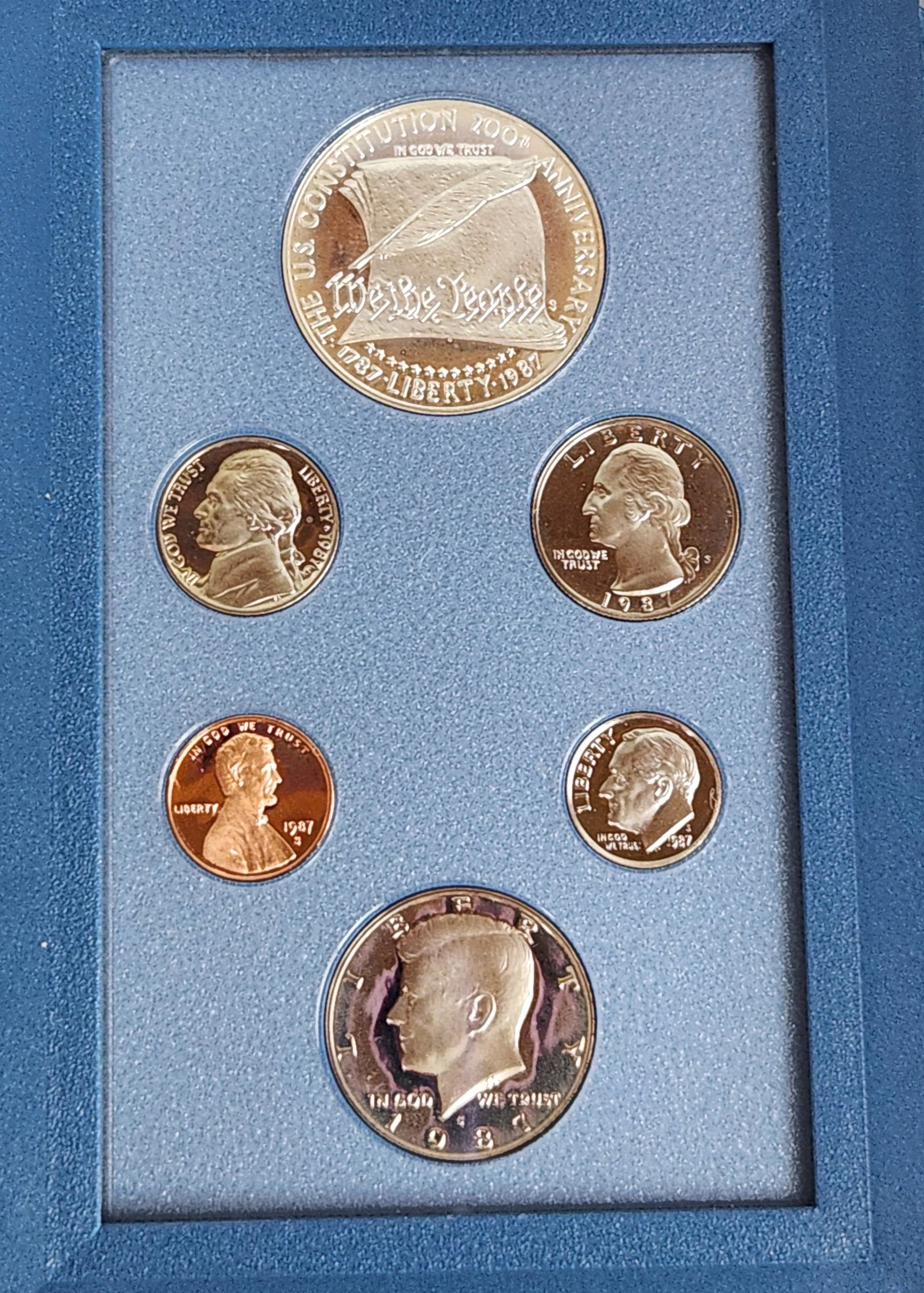 US 1987 Prestige Proof Set: A 1987 United States Prestige Proof Set issued by the US Mint. The set comprises a collection of coins including a 1987-S Constitution Bicentennial Commemorative Silver Dollar, a Kennedy half dollar, 