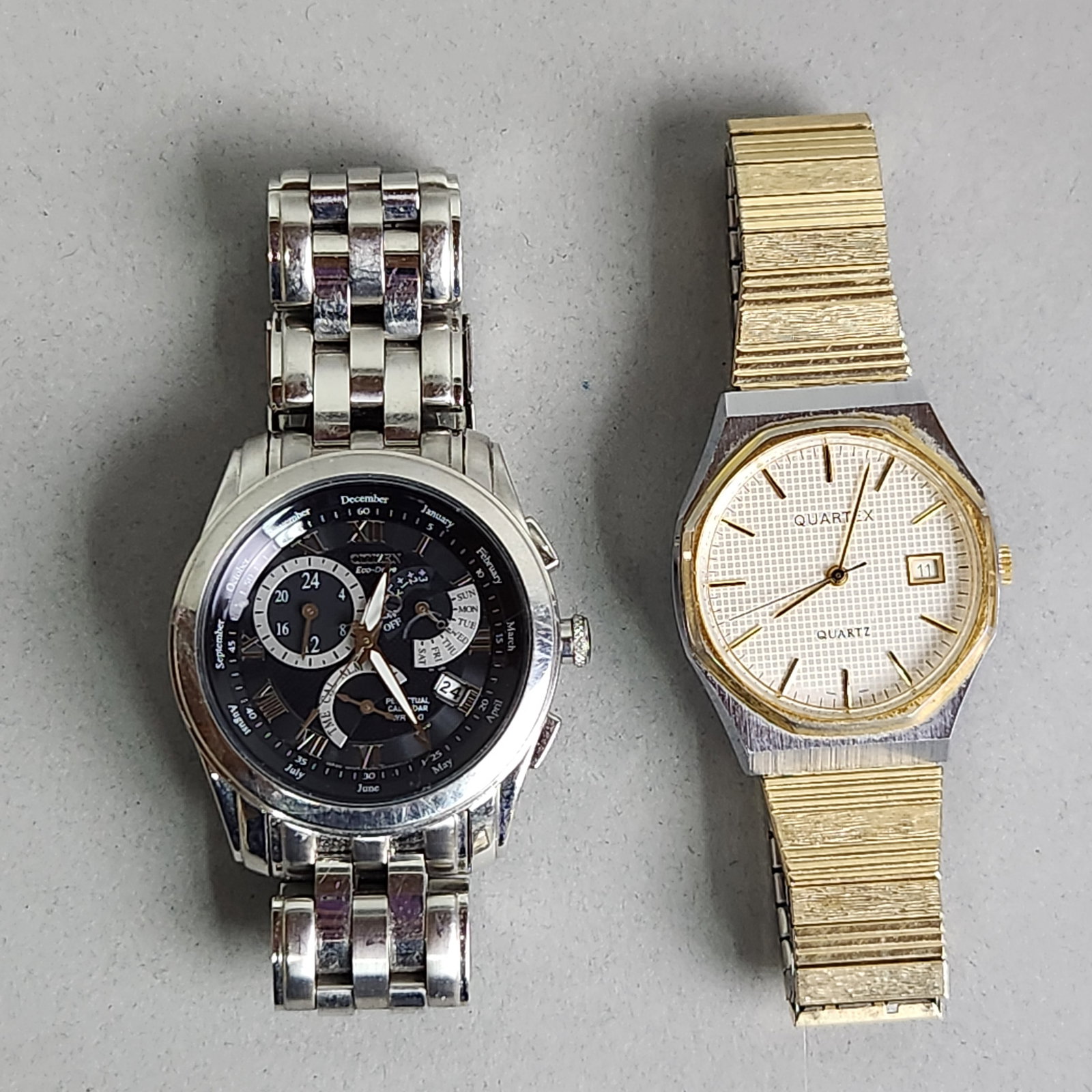 Citizen Eco-Drive Calibre 8700 & Quartex Quartz Watch: This lot features two men's wristwatches. The first is a Citizen Eco-Drive Calibre 8700 Perpetual Calendar watch, reference number E870-S016278. I The second watch is a Quartex quartz timepiece with a