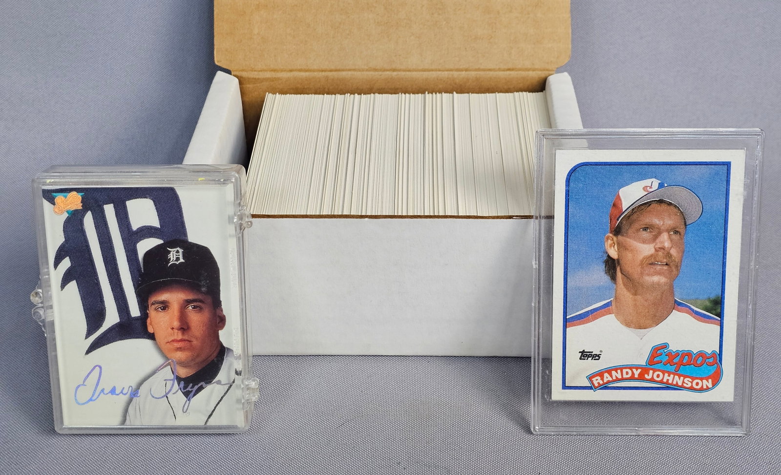 Collection of Vintage Baseball Cards: This lot consists of an assortment of baseball cards from the late 1980s and early 1990s. The primary highlight is a 1989 Topps Randy Johnson rookie card, number 647, showing Johnson in a Montreal Exp