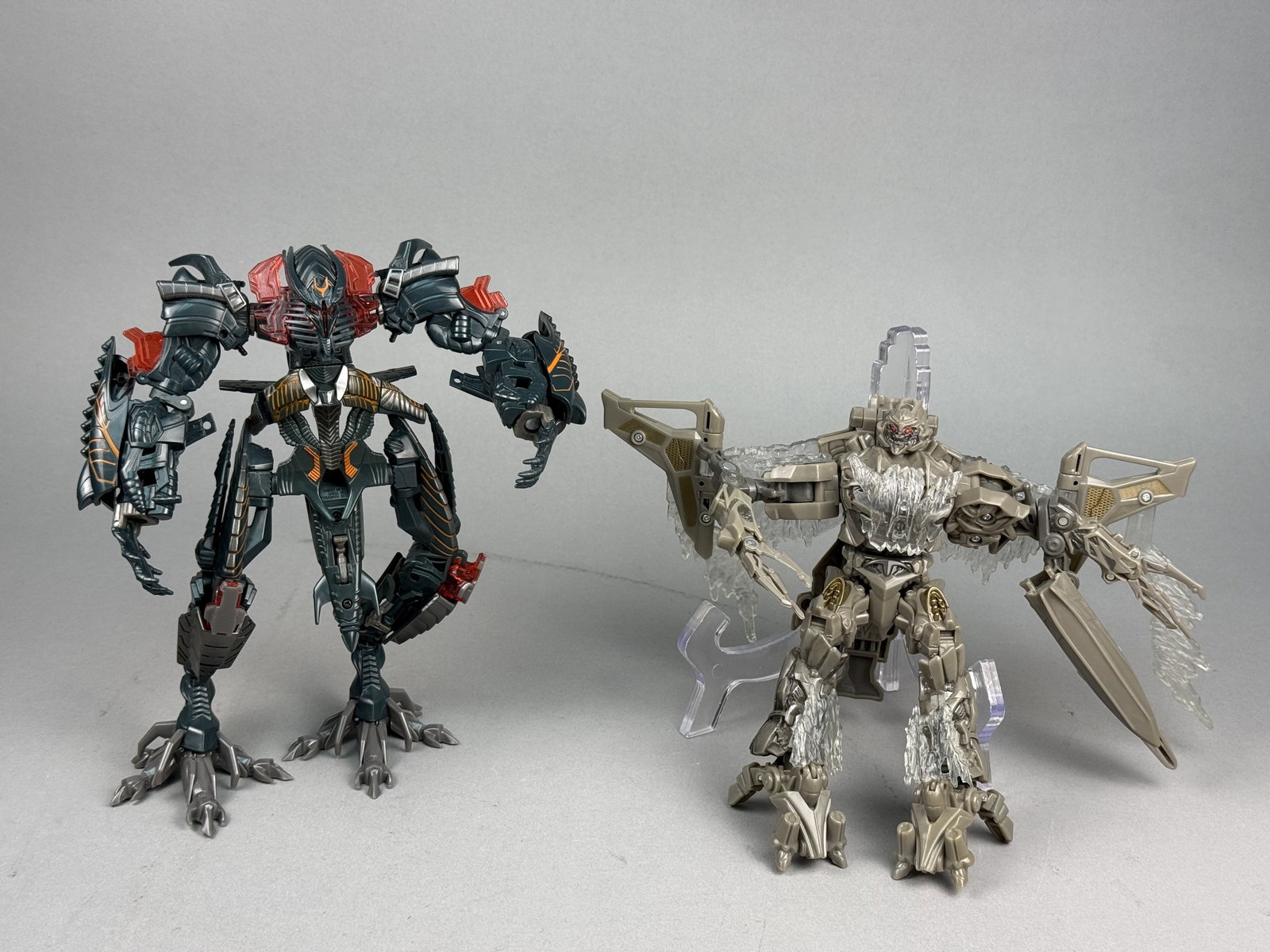 Transformers Movie Voyager Class Action Figures: This lot consists of two loose Transformers action figures from the Hasbro live-action movie toy lines. The first figure is a Voyager Class The Fallen from the 2009 Revenge of the Fallen series. It is