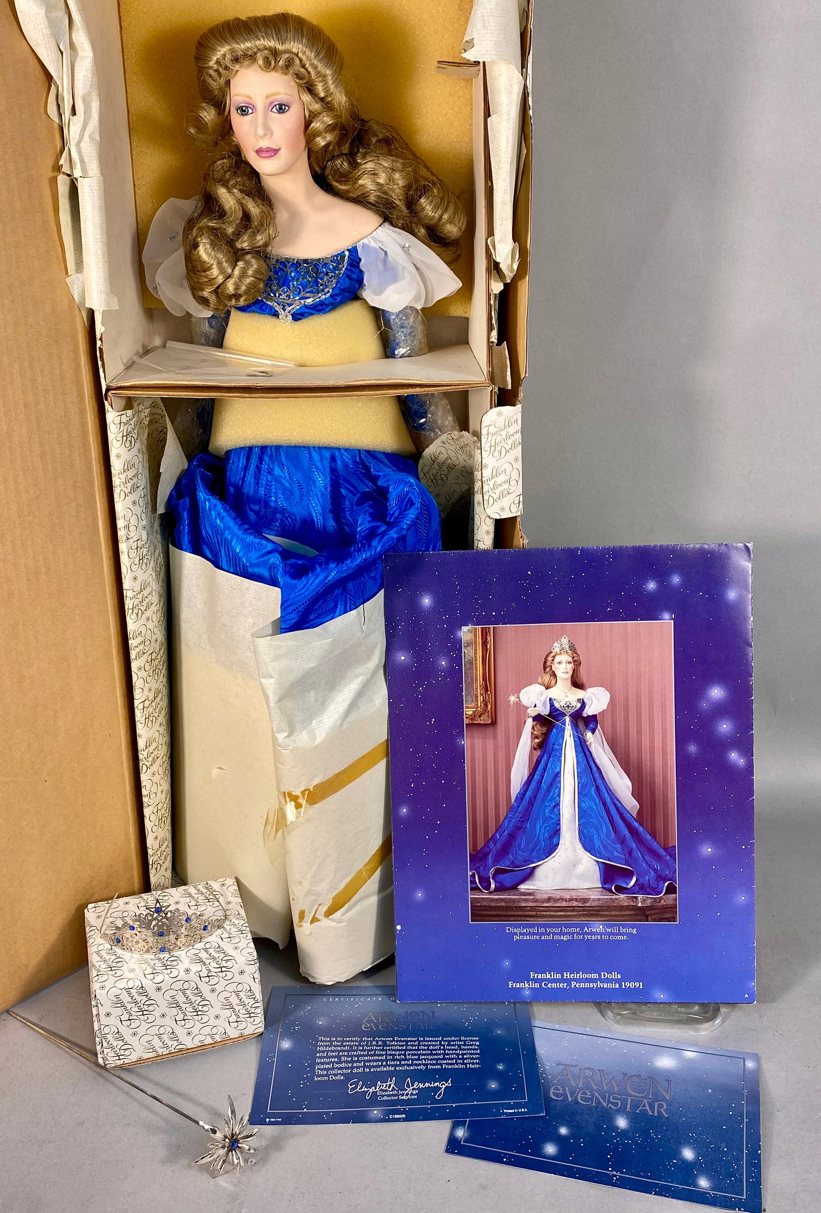 Franklin Heirloom Dolls Arwen Evenstar Collector Doll: Franklin Heirloom Dolls Arwen Evenstar collector doll, designed by artist Greg Hildebrandt under license from the estate of J.R.R. Tolkien. The doll is constructed with a head, hands, and feet of fine