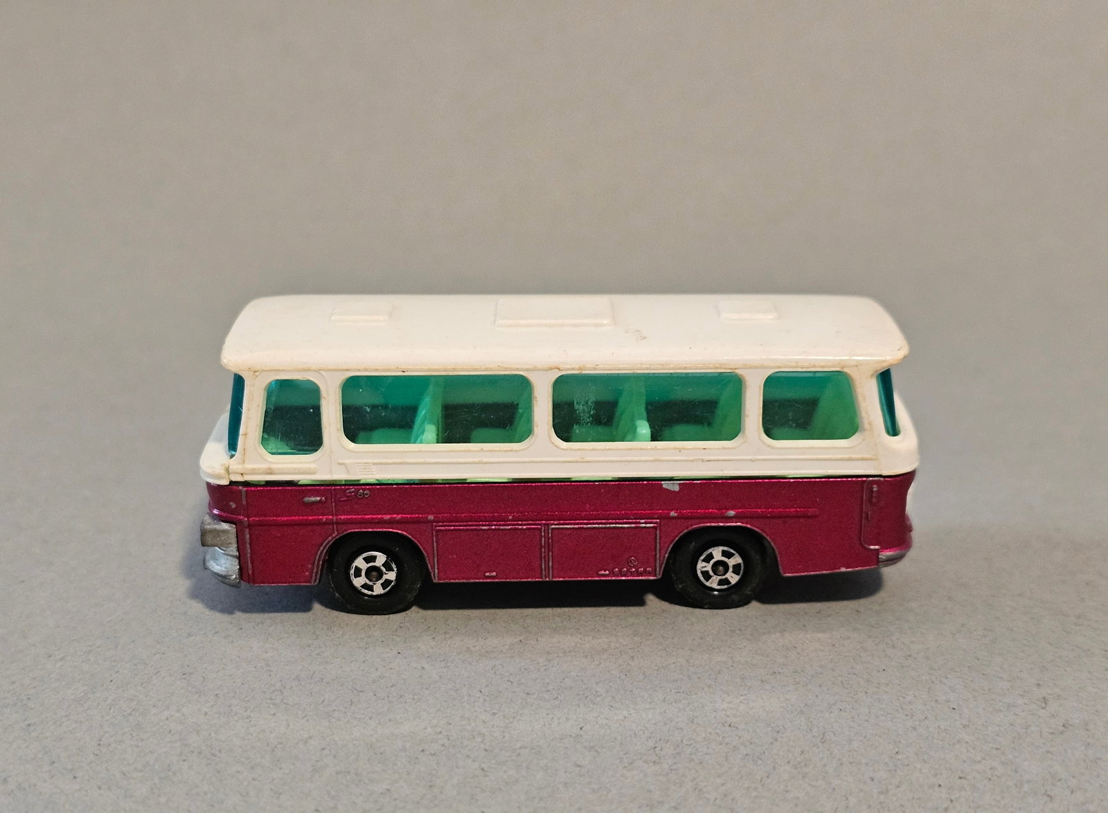 Matchbox Series No. 12 Setra Coach: This vintage Matchbox Series No. 12 Setra Coach was manufactured by Lesney Products & Co. Ltd. in England. 1970 Length: Approximately 3 inches. The item is in well-played-with condition. There is stru