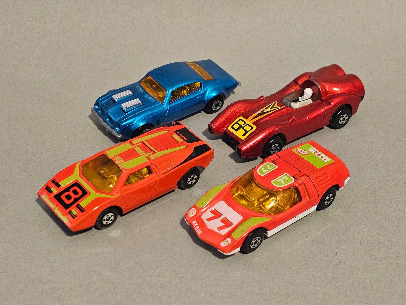Group of Vintage Matchbox Cars: This assortment consists of vintage die-cast toy vehicles manufactured by Lesney Products & Co. Ltd. in England under the Matchbox brand during the 1970s. The group features models from the Superfast 
