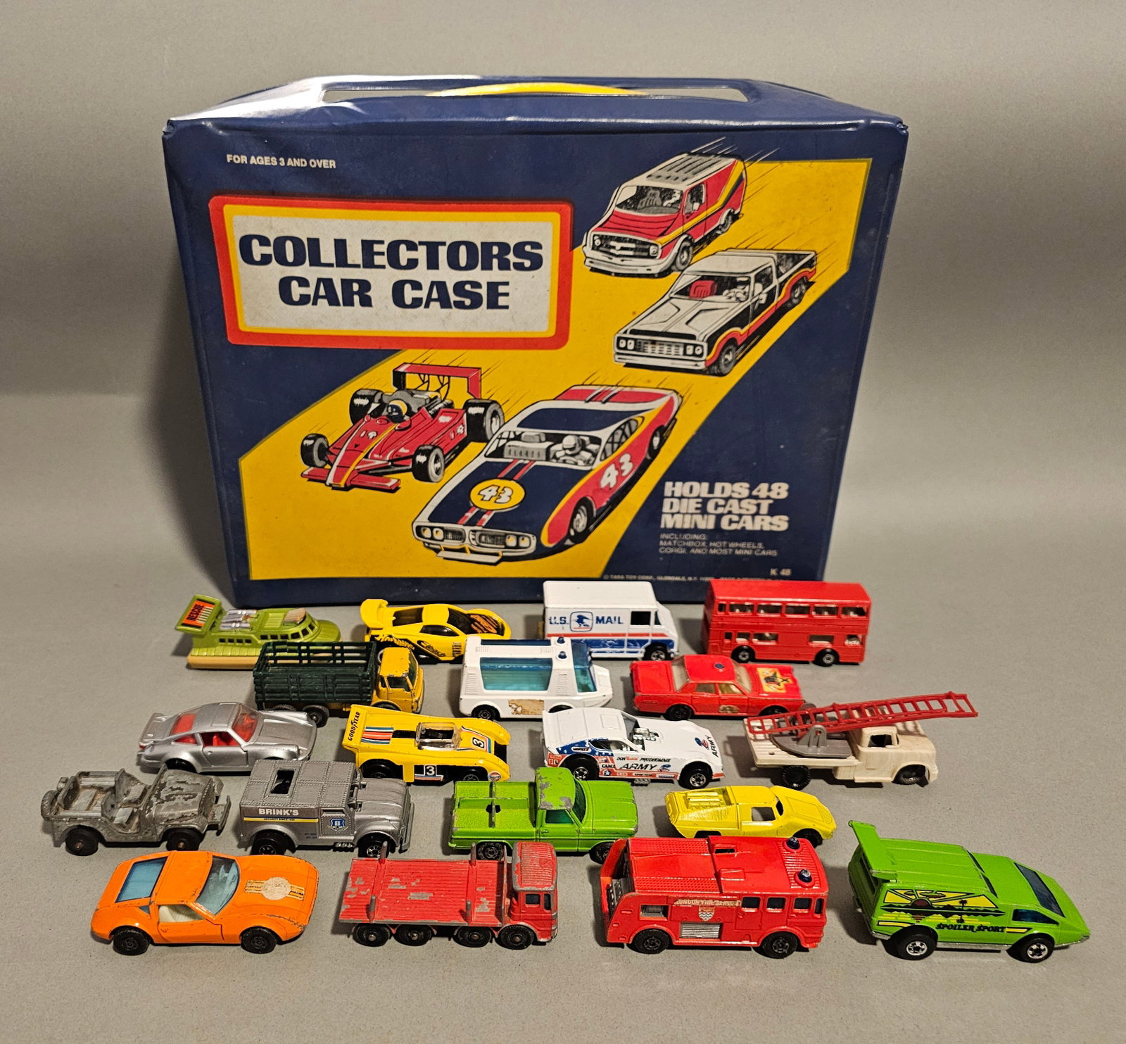 Die-Cast Toy Vehicles and a Collectors Car Case: This collection features nineteen vintage die-cast toy vehicles and a themed vinyl carrying case, primarily dating from the 1970s. The blue vinyl case is produced by Tara Toy Corp. of Glendale, New Yo