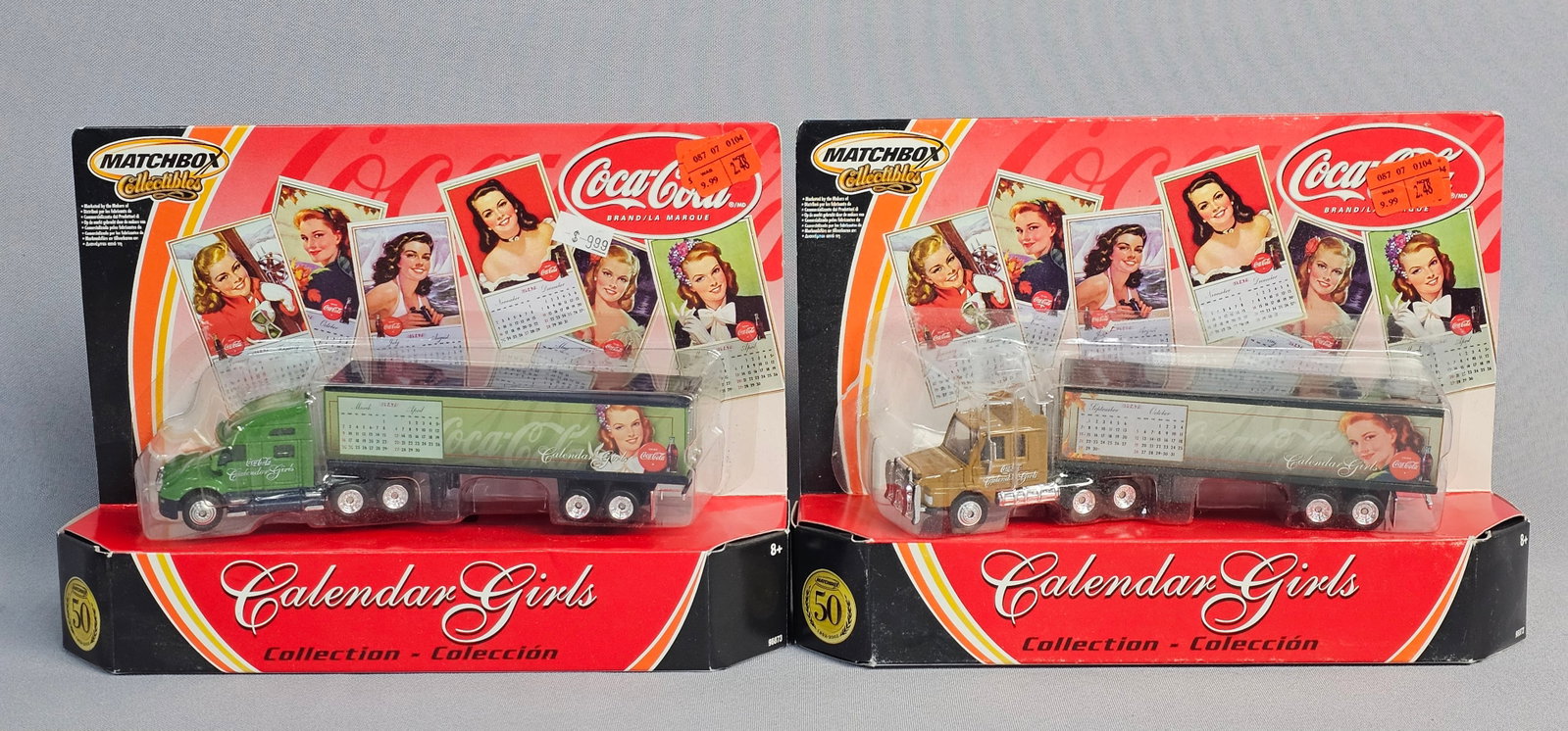 Pair of Coca-Cola Calendar Girls Die-Cast Semi-Trucks: A pair of Matchbox Collectibles die-cast tractor-trailers from the Coca-Cola Calendar Girls Collection. These models were manufactured by Mattel, Inc. in 2001 to commemorate the Matchbox 50th Annivers