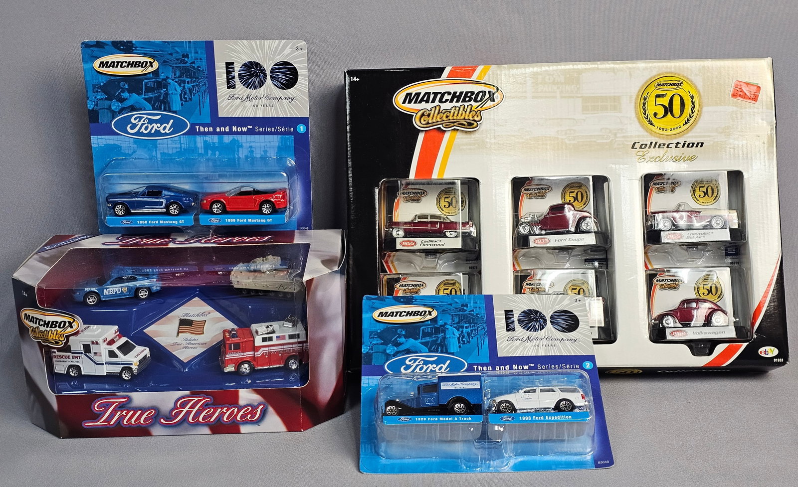 Four Matchbox Collectibles Sealed Vehicle Sets: A collection of 14 die-cast vehicles across four factory-sealed commemorative sets manufactured by Matchbox (Mattel, Inc.). All vehicles feature die-cast metal bodies with plastic chassis and free-rol