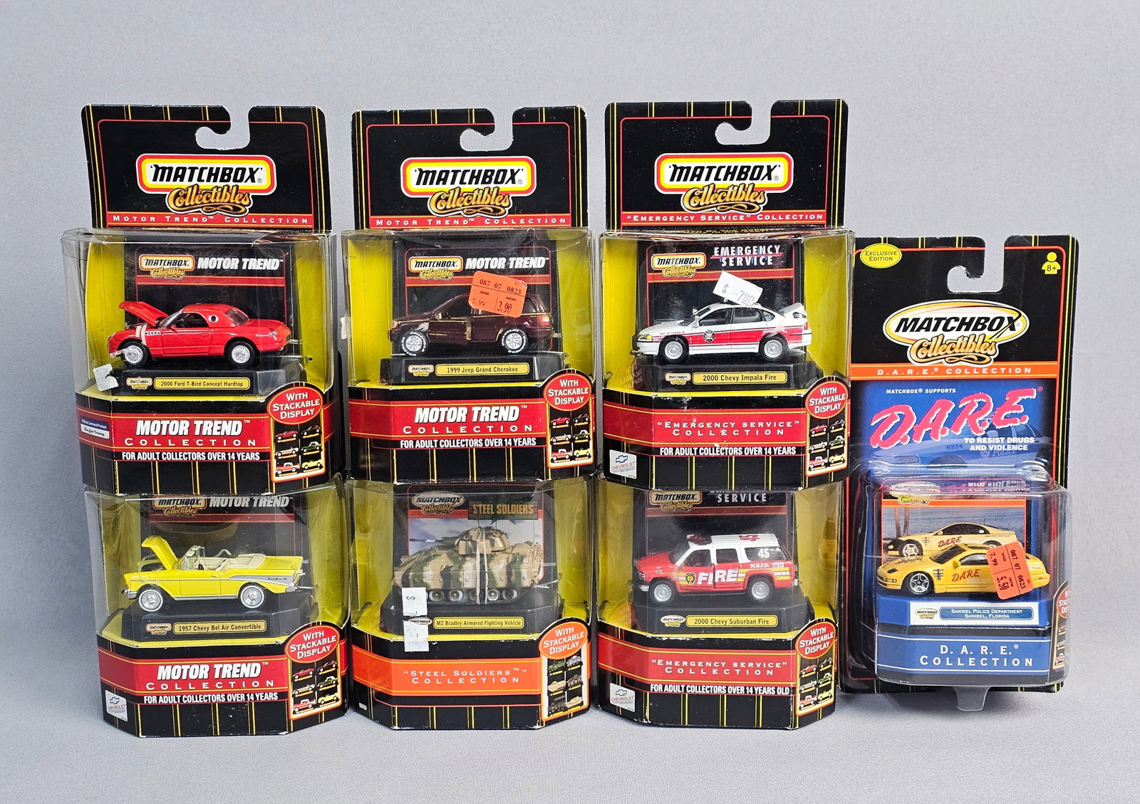 Seven Matchbox Collectibles Vehicles: A collection of seven die-cast metal vehicles produced by Matchbox Collectibles. This group includes selections from multiple specialized series: the Motor Trend Collection, the Emergency Service Coll