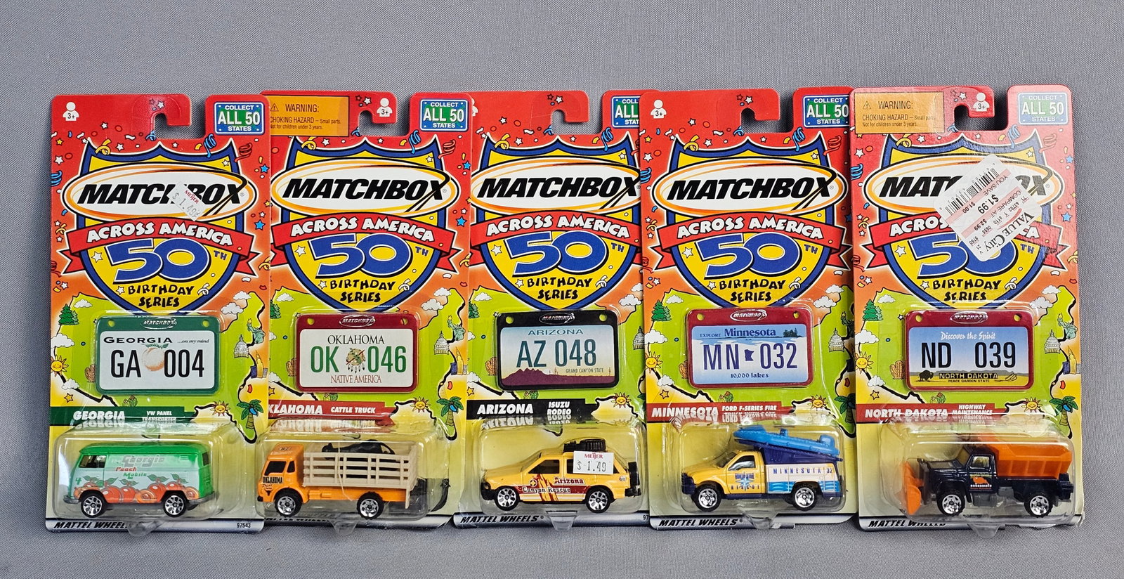 Matchbox Across America Vehicles: This lot features five die-cast vehicles from the Matchbox Across America 50th Birthday Series, produced by Mattel to celebrate the brand's 50th anniversary. Each vehicle is contained within its origi
