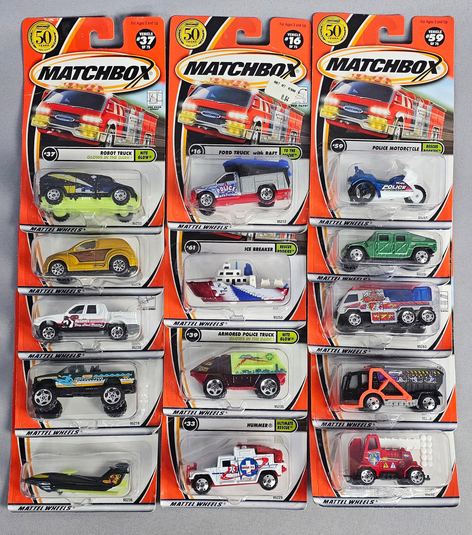 Matchbox Die-Cast Vehicles in Original Packaging: A lot of fourteen die-cast toy vehicles manufactured by Mattel under the Matchbox brand to commemorate the 50th anniversary of the marque (1952-2002). Each vehicle is constructed from die-cast metal w