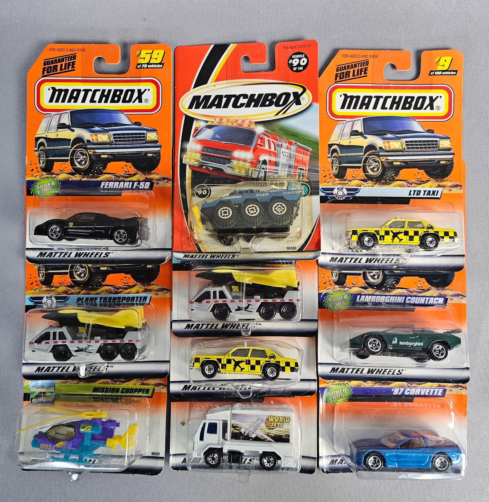 Vintage Mattel Matchbox Toy Vehicles: This collection features ten Matchbox die-cast vehicles manufactured by Mattel, Inc. between 1998 and 1999. Each vehicle is housed in its original blister card packaging. The items are primarily const