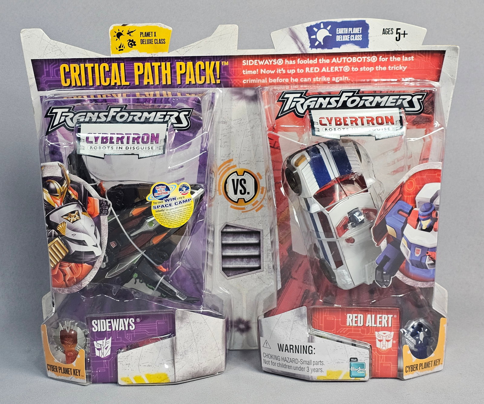 Transformers Action Figure Two Pack: This is a factory-sealed Transformers Cybertron Critical Path Pack action figure two-pack, manufactured by Hasbro in 2005 under license from Takara Co., Ltd. The set contains two plastic transformable