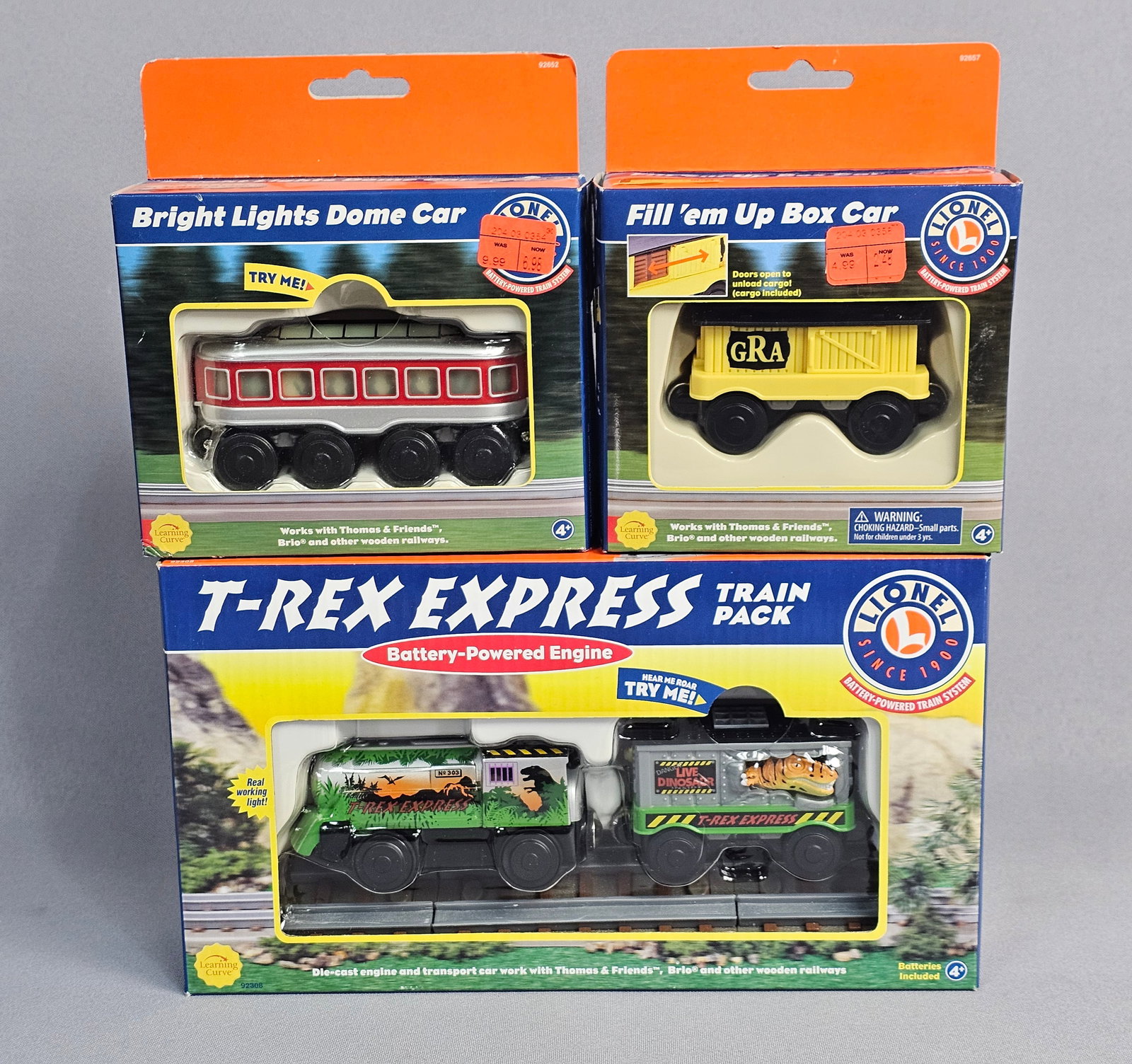 Learning Curve Battery-Powered Toy Train Items: This lot comprises three factory-sealed toy train items from the Lionel Battery-Powered Train System, manufactured by Learning Curve International, Inc. under license from Lionel, L.L.C. The collectio